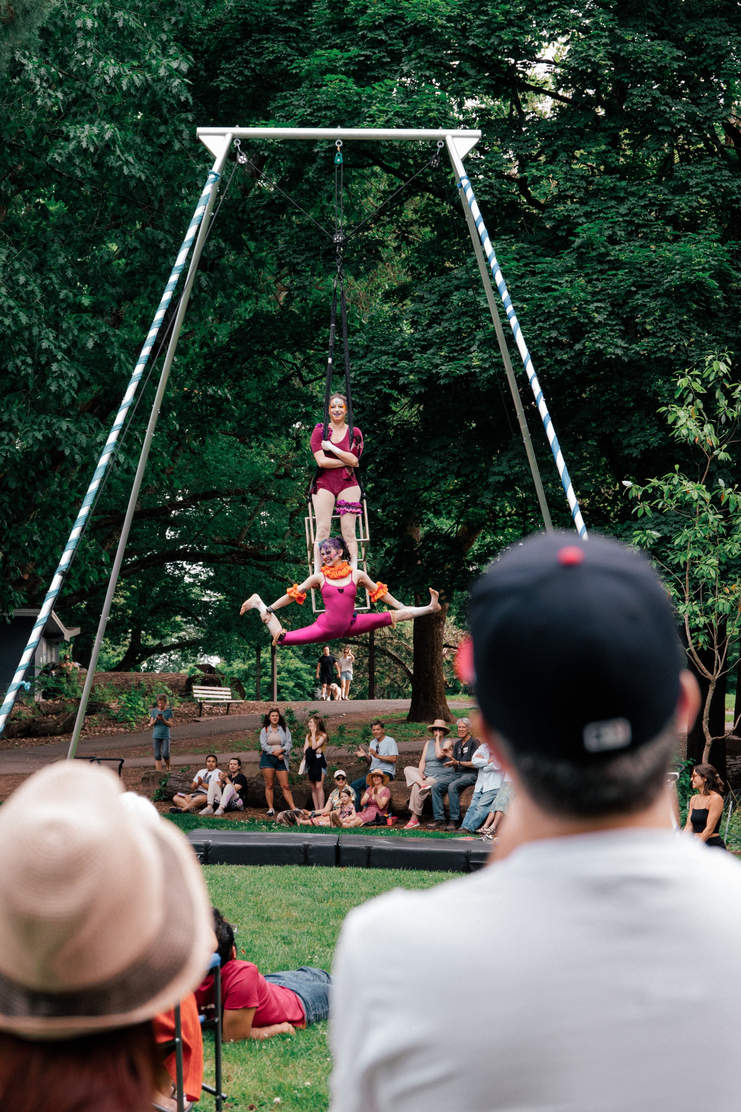 Kenzie basing Cassidy from feet in aerial chair duet.