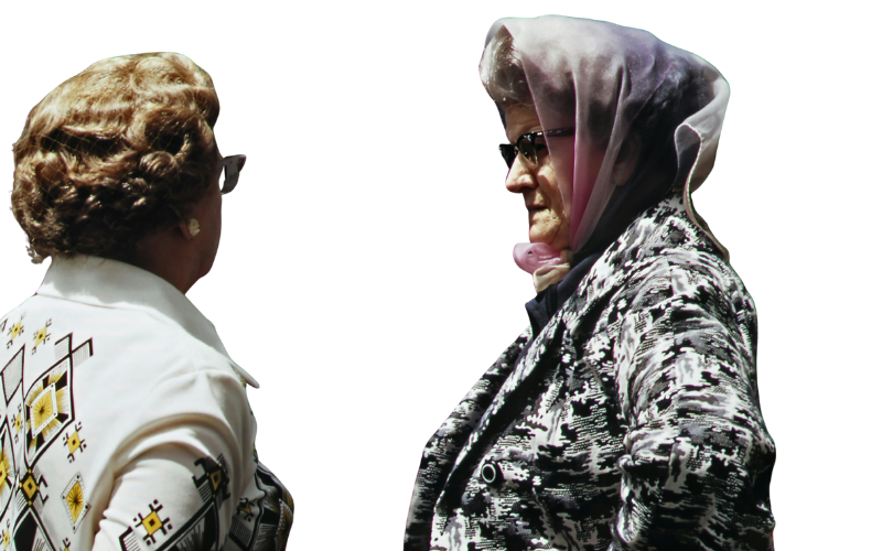 Two women facing each other, engaged in conversation, with colorful line borders around the image.