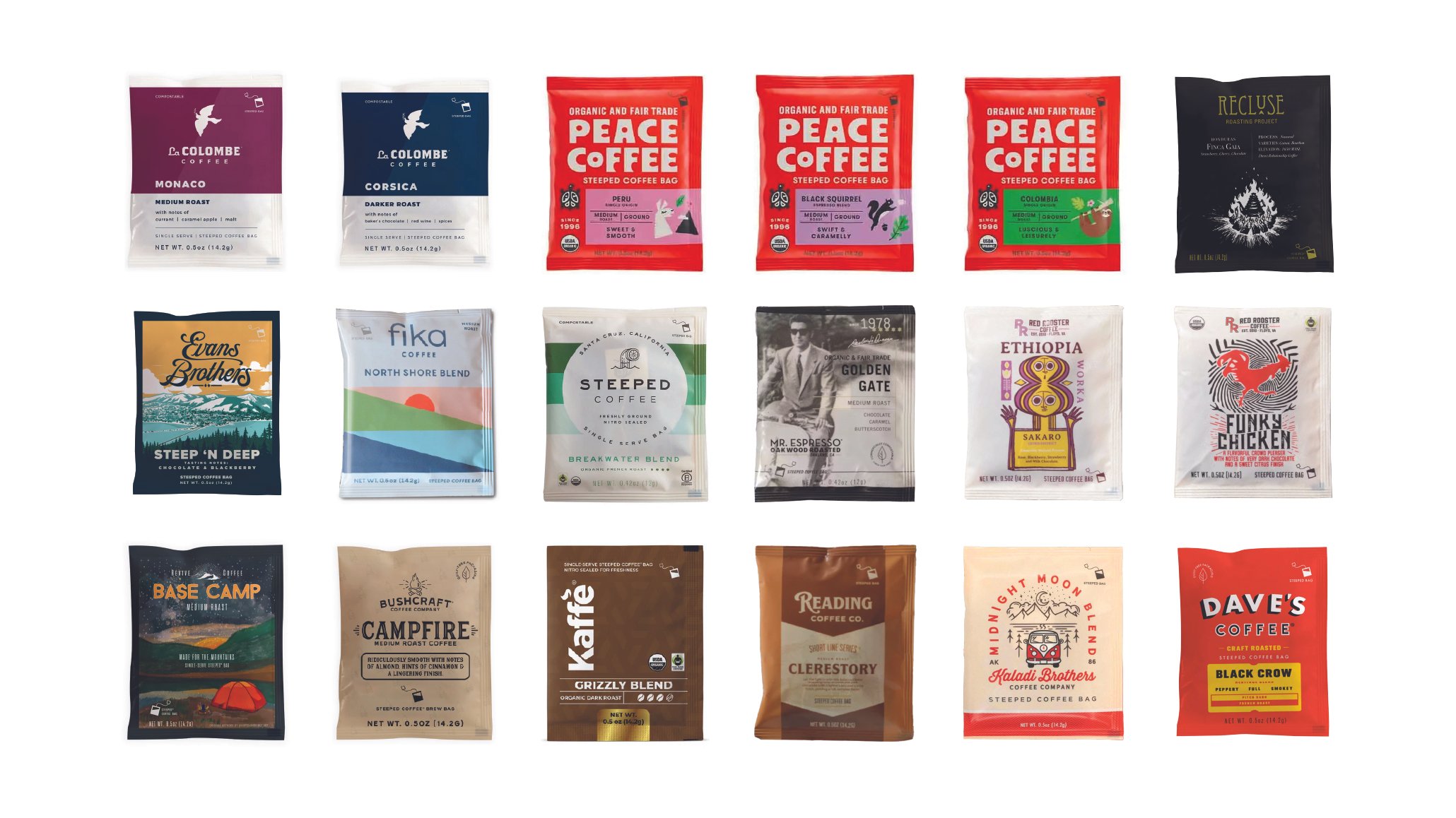 A variety of coffee packets displayed on a white surface.