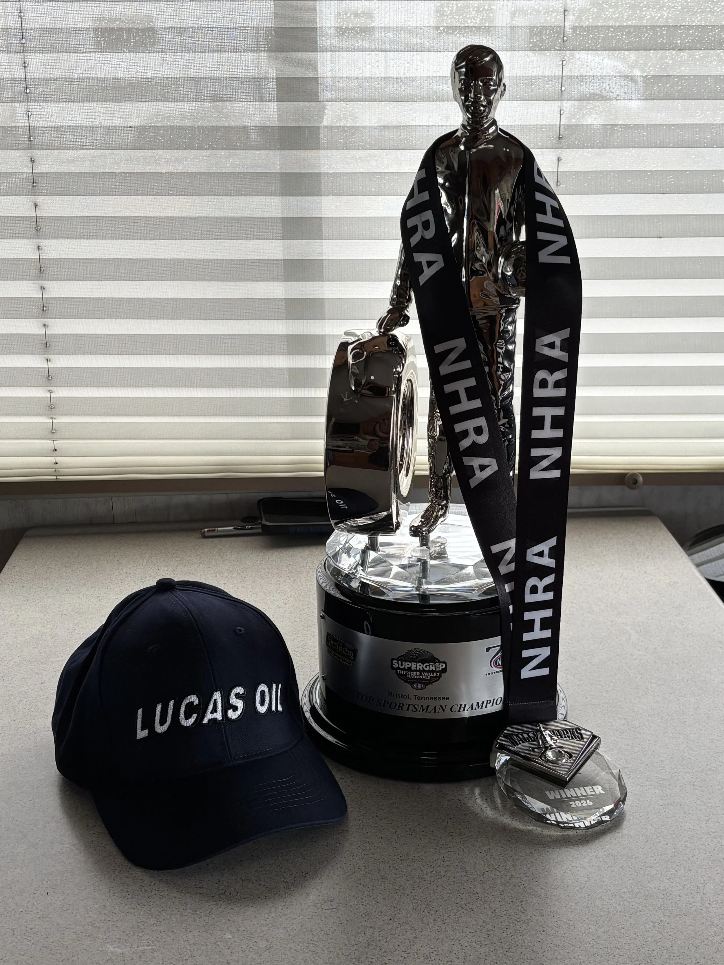 The winner's Wally, medal and hat