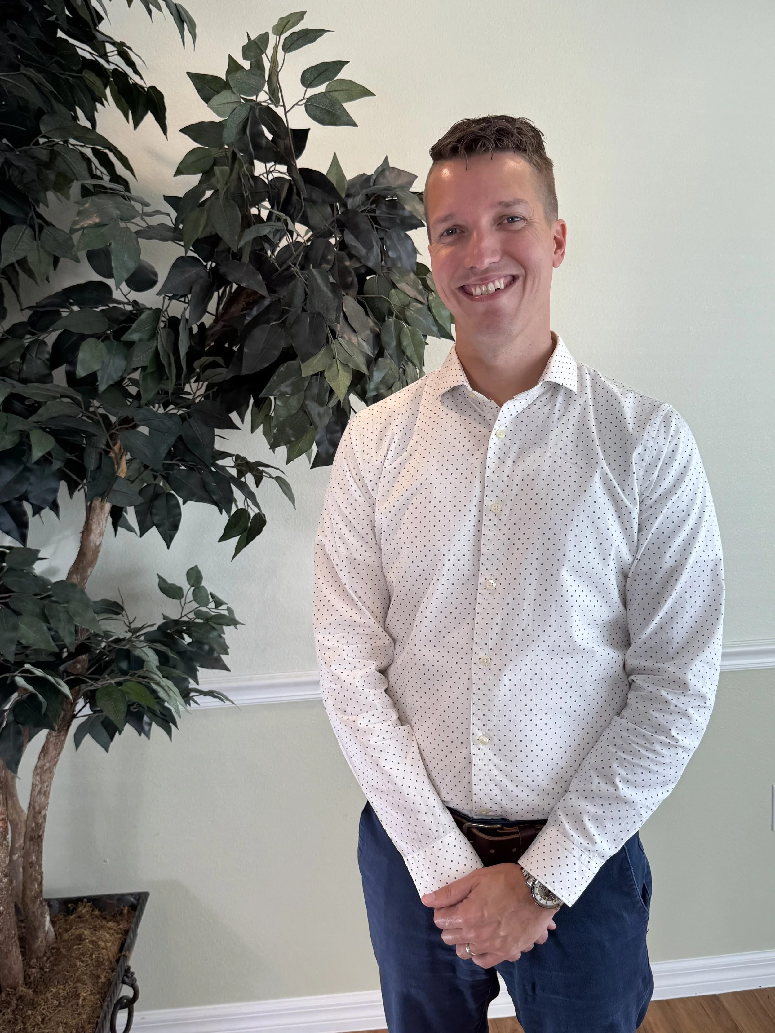 Tyler Smith standing in the lobby at Alpha headquarters