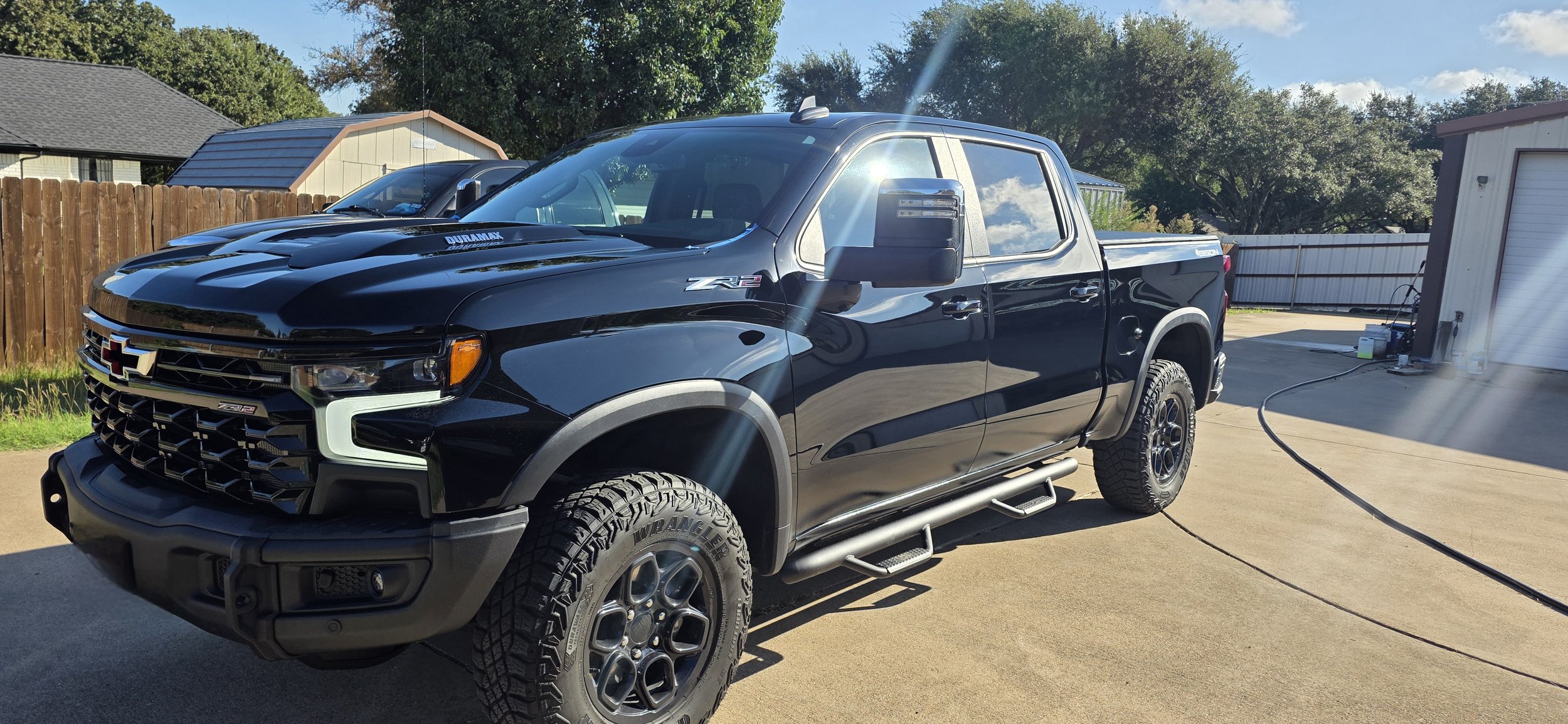 Black Chevrolet Silverado ZR2 pickup truck showing off insane gloss in direct sunlight