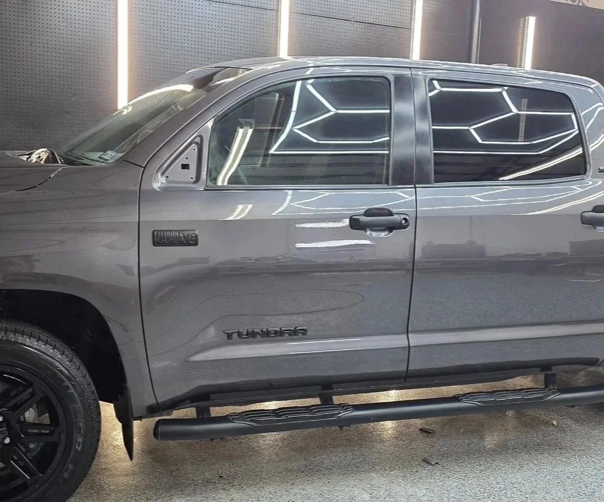 Gray Toyota Tundra pickup truck after getting driver door repainted from damages in Burleson Tx