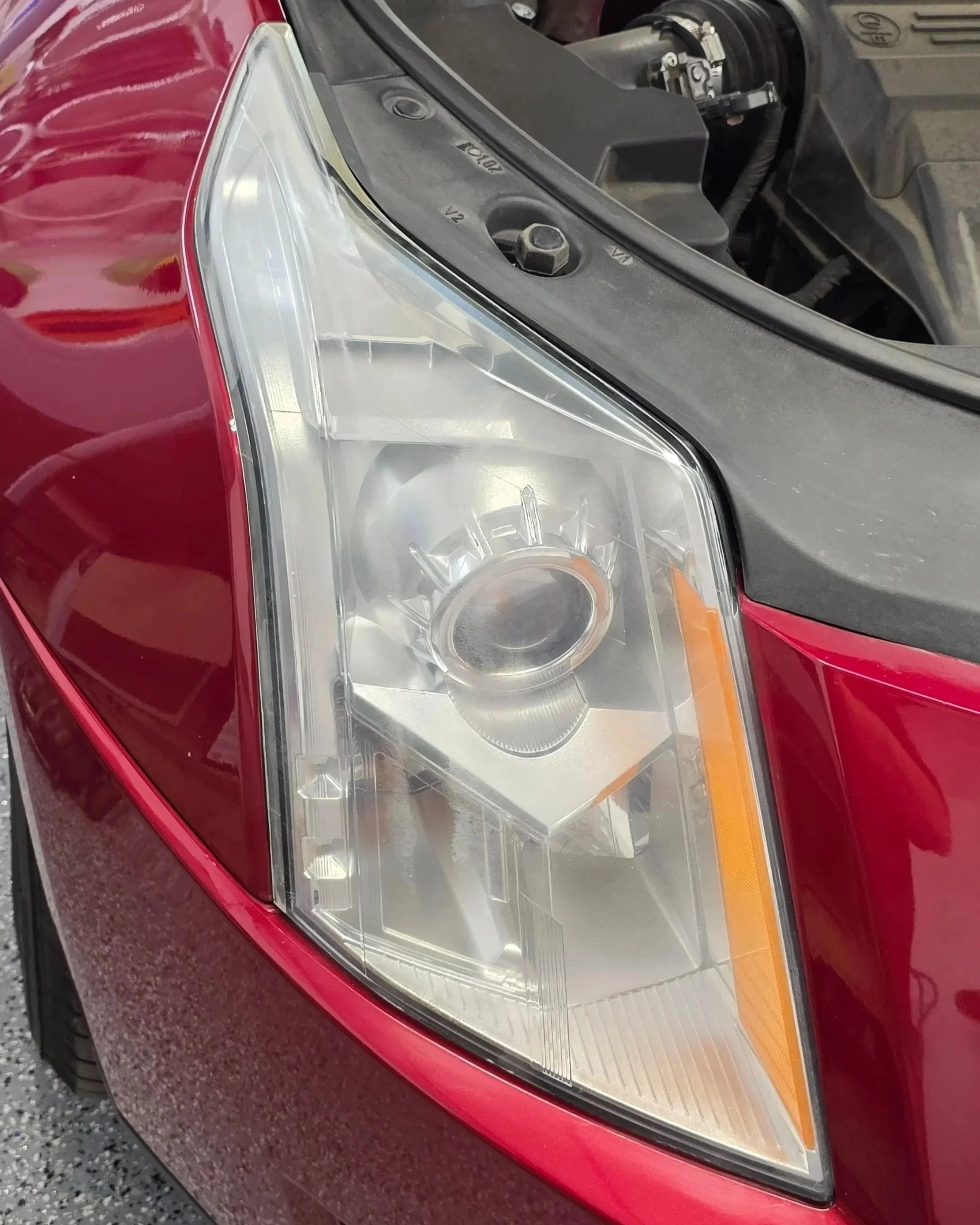 before headlight restoration on Cadillac in Burleson, TX 76028