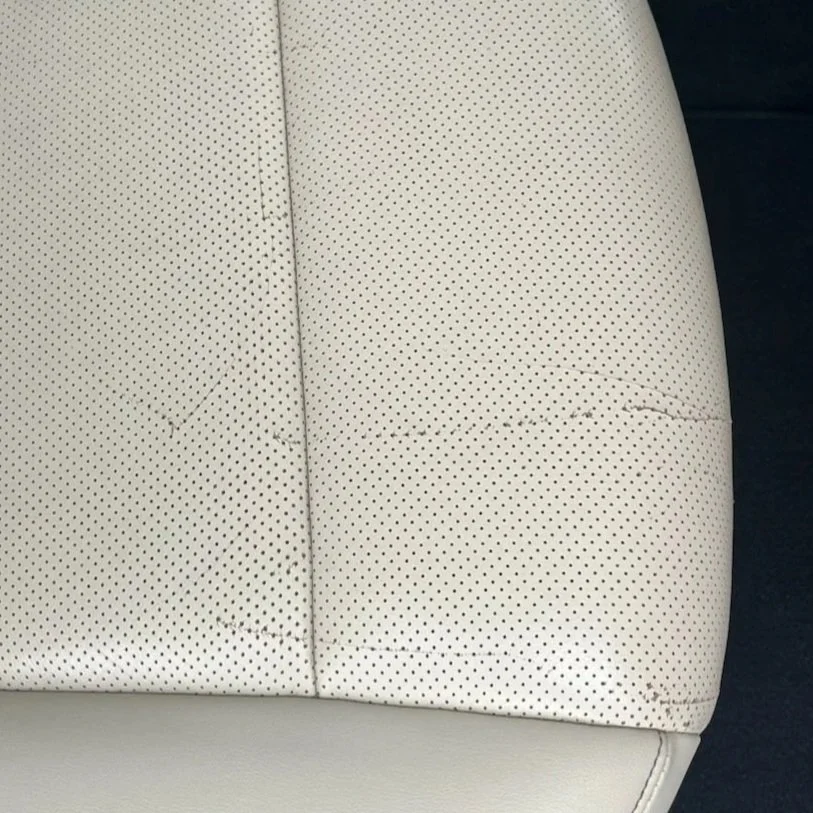 leather damage before cosmetic repair done on this seat in Burleson Tx