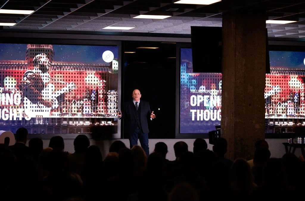 Doug Dome presenting to a business audience.
