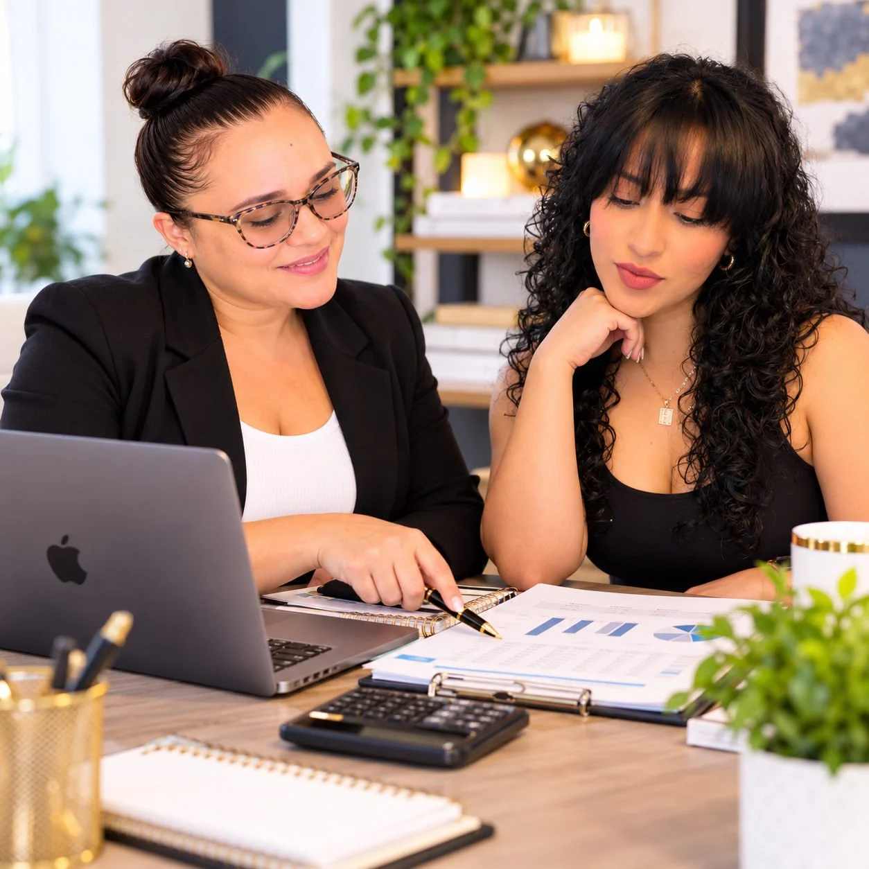 NexxLevel owner reviewing financial reports with a small business client during an accounting consultation in Lacey, Washington.
