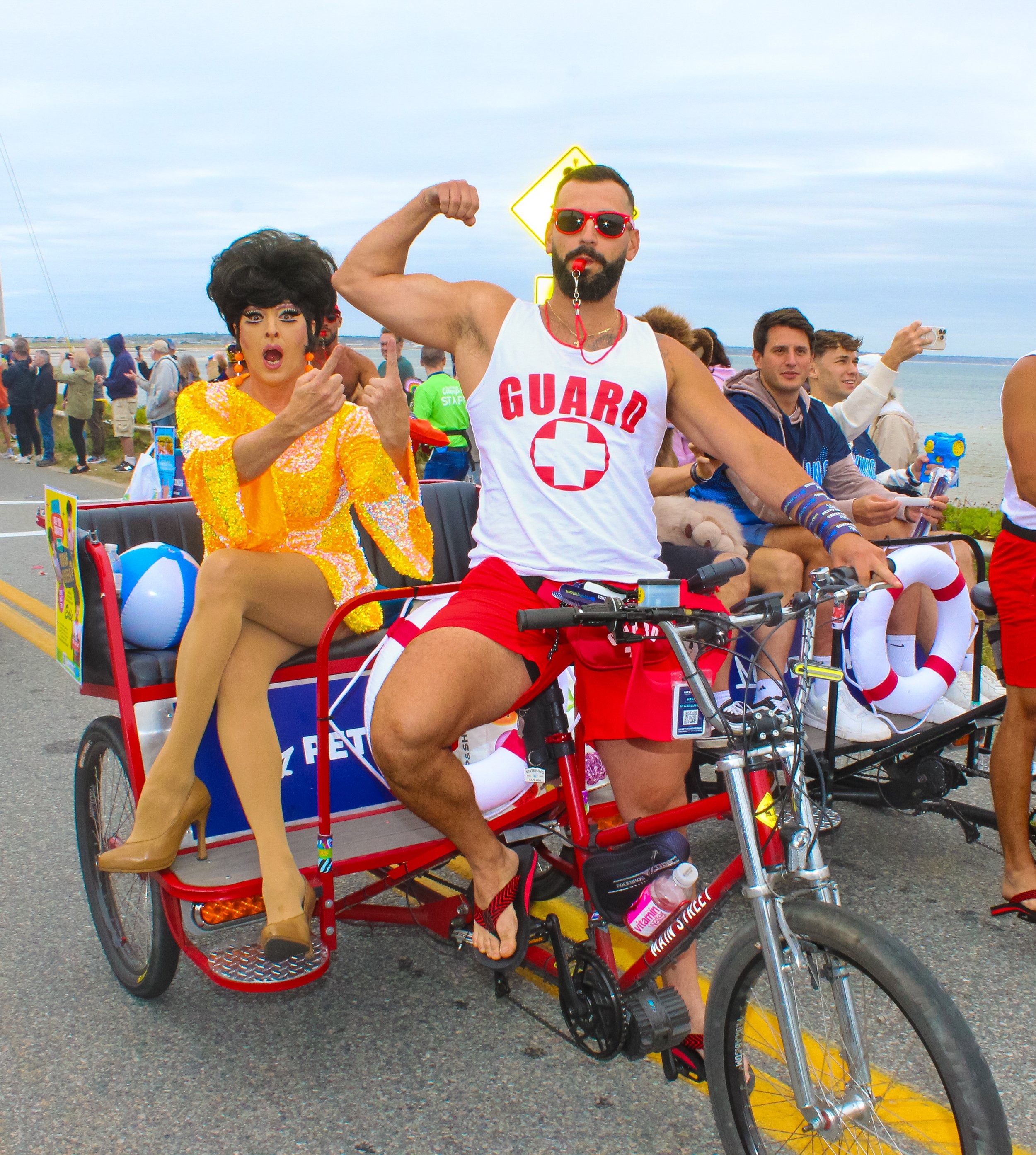 Petty Kings Provincetown Cape Cod Ptown Pedicabs Bicycle Taxis Ptown Boy Toy Pedicabs Photo on Beach Flexing Carnival Parade Drag Queens Harbor Hotel Provincetown Business Guild PBG
