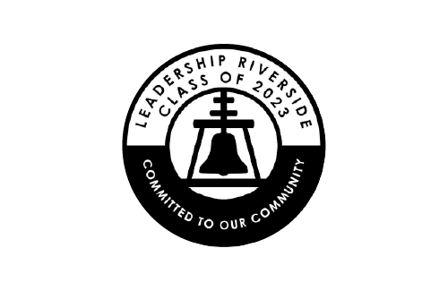 A black and white circular logo for Leadership Riverside, Class of 2025, with a bell in the center and the text 'Committed to Our Community' around it.