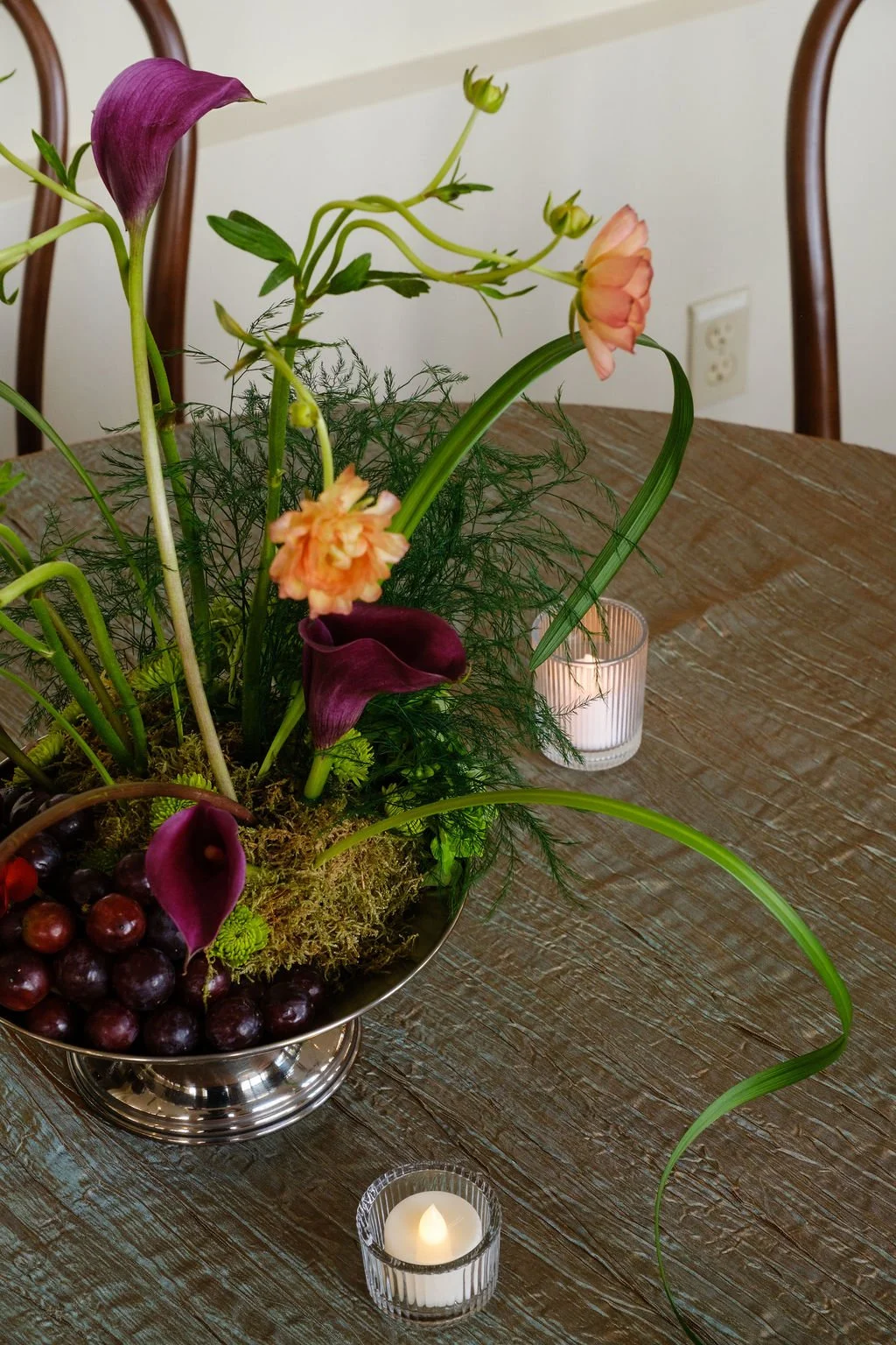 Greenery forward centerpiece with seasonal florals New Orleans plant rentals and Floral