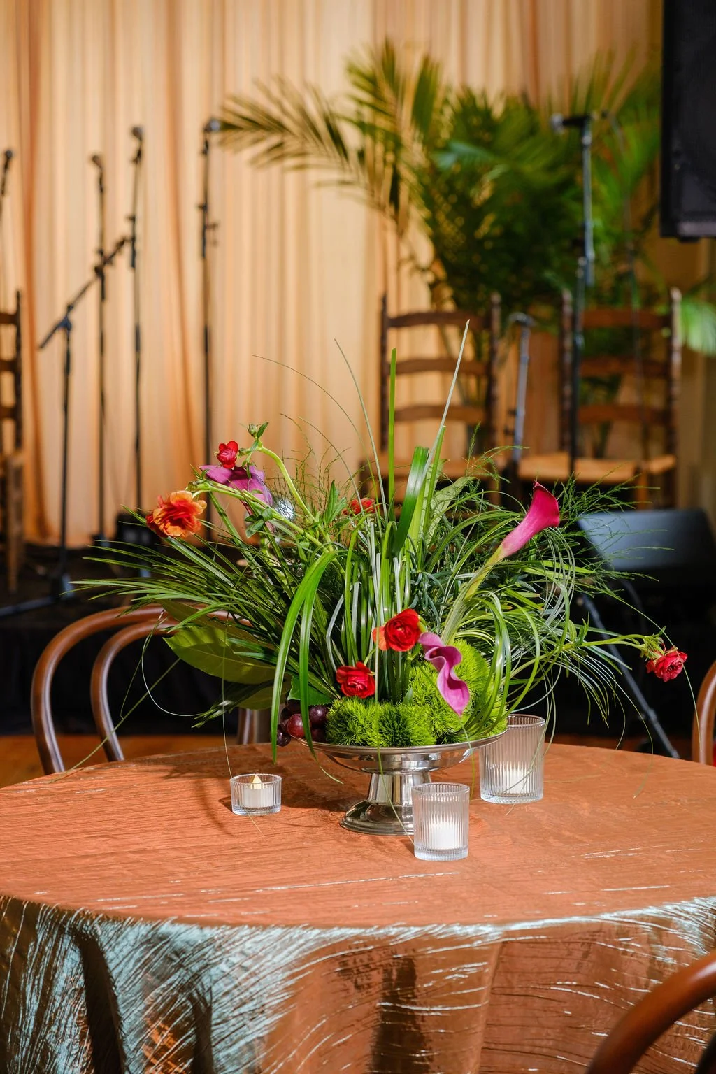 Greenery forward centerpiece with seasonal florals New Orleans plant rentals and Floral