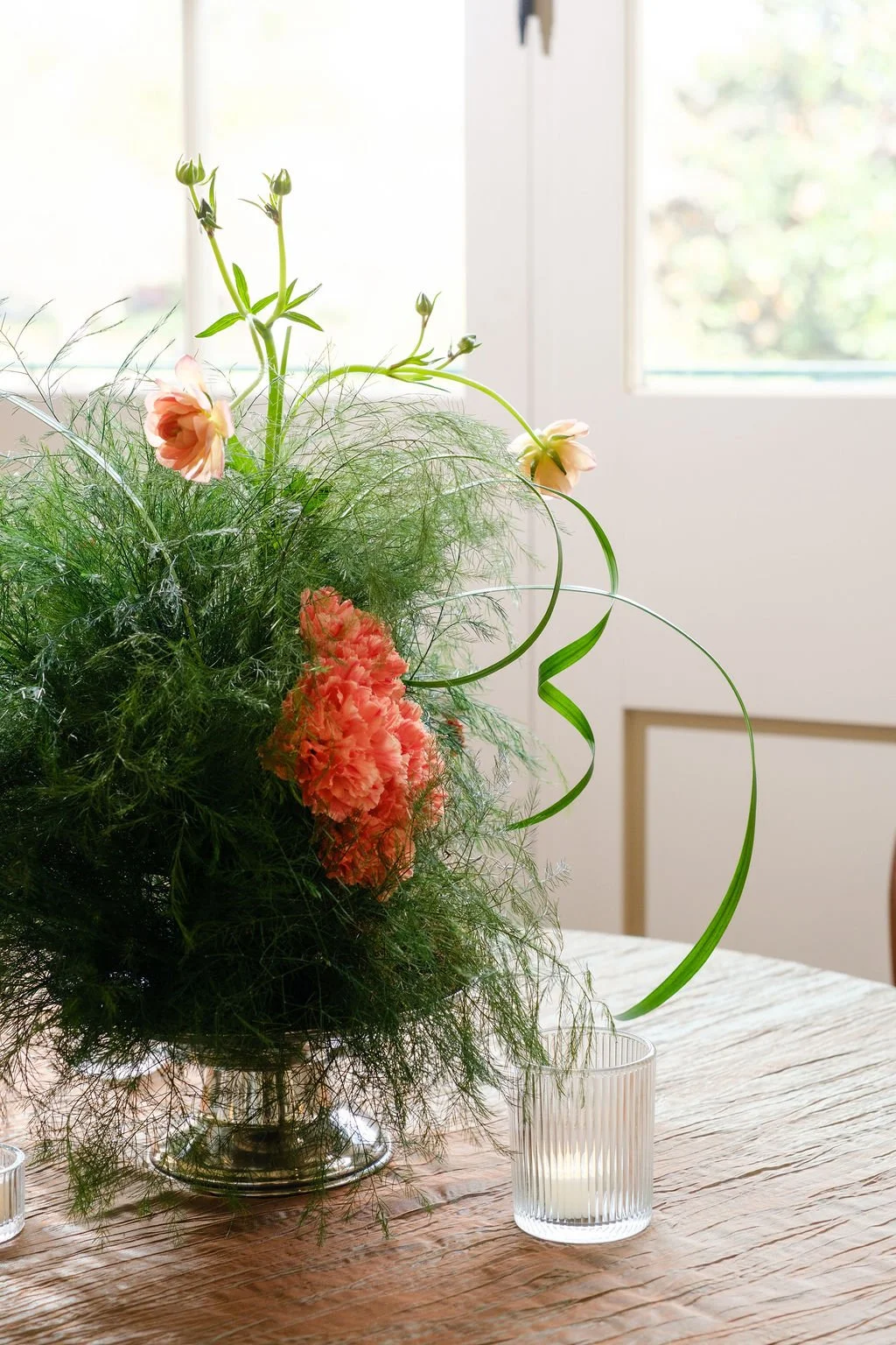 Greenery forward centerpiece with seasonal florals New Orleans plant rentals and New Orleans event florals corporate events and weddings