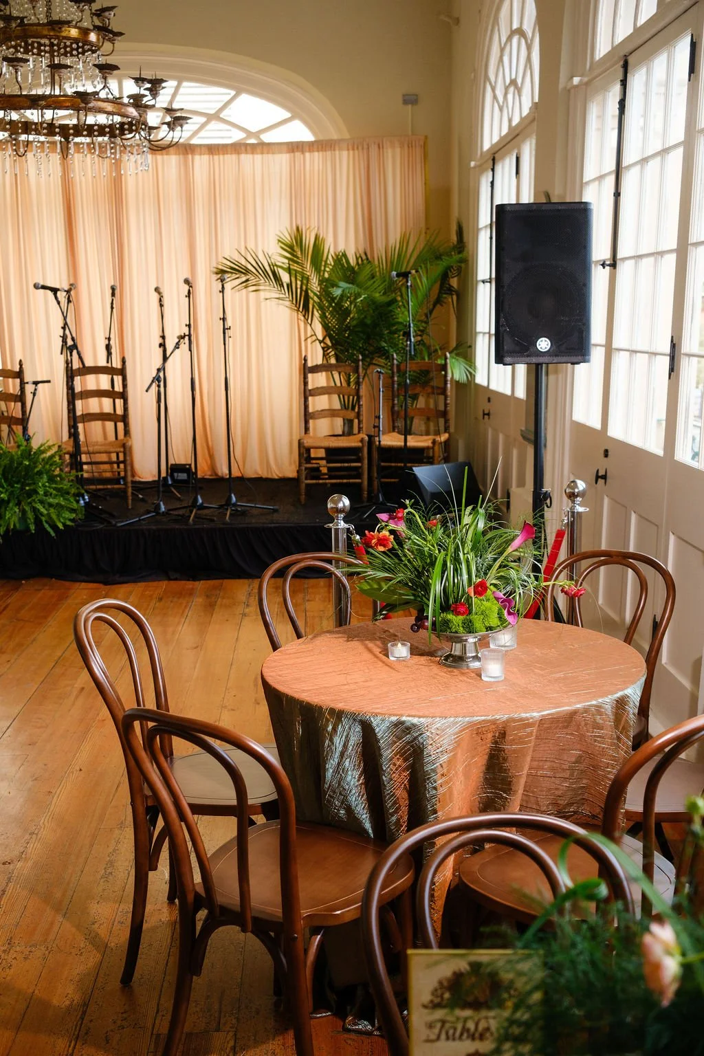 Stage greenery rentals that soften AV and create dimension.