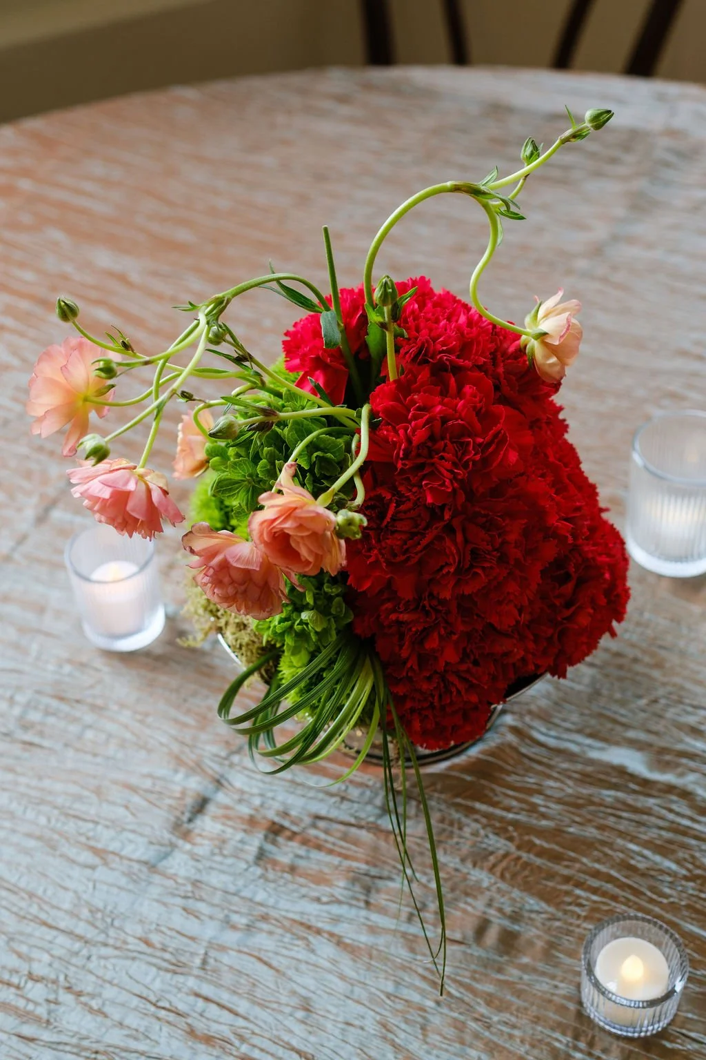 Greenery forward centerpiece with seasonal florals New Orleans plant rentals and Floral