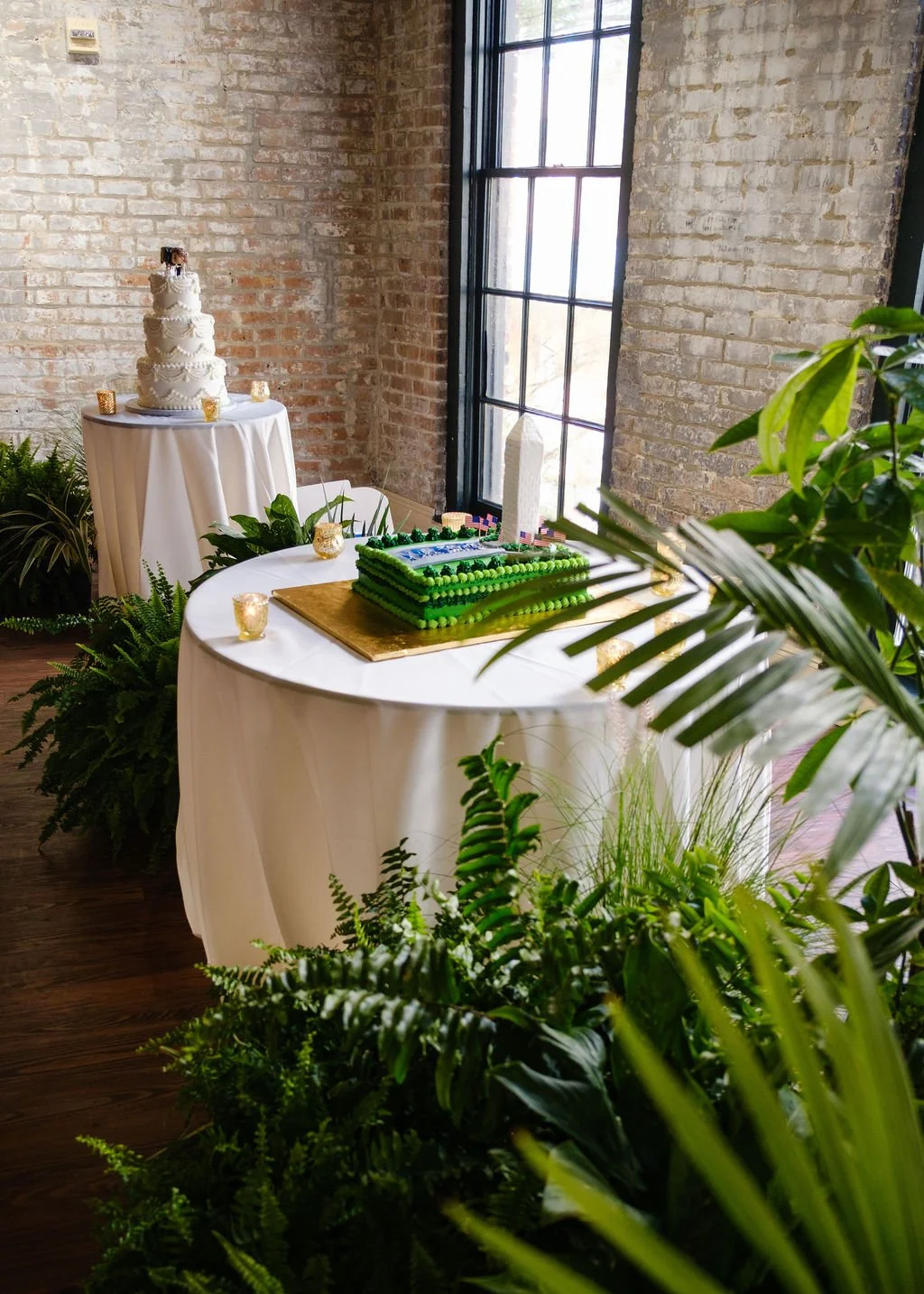 modern-wedding-reception-plant-decor-bar-and-cake-display.jpg