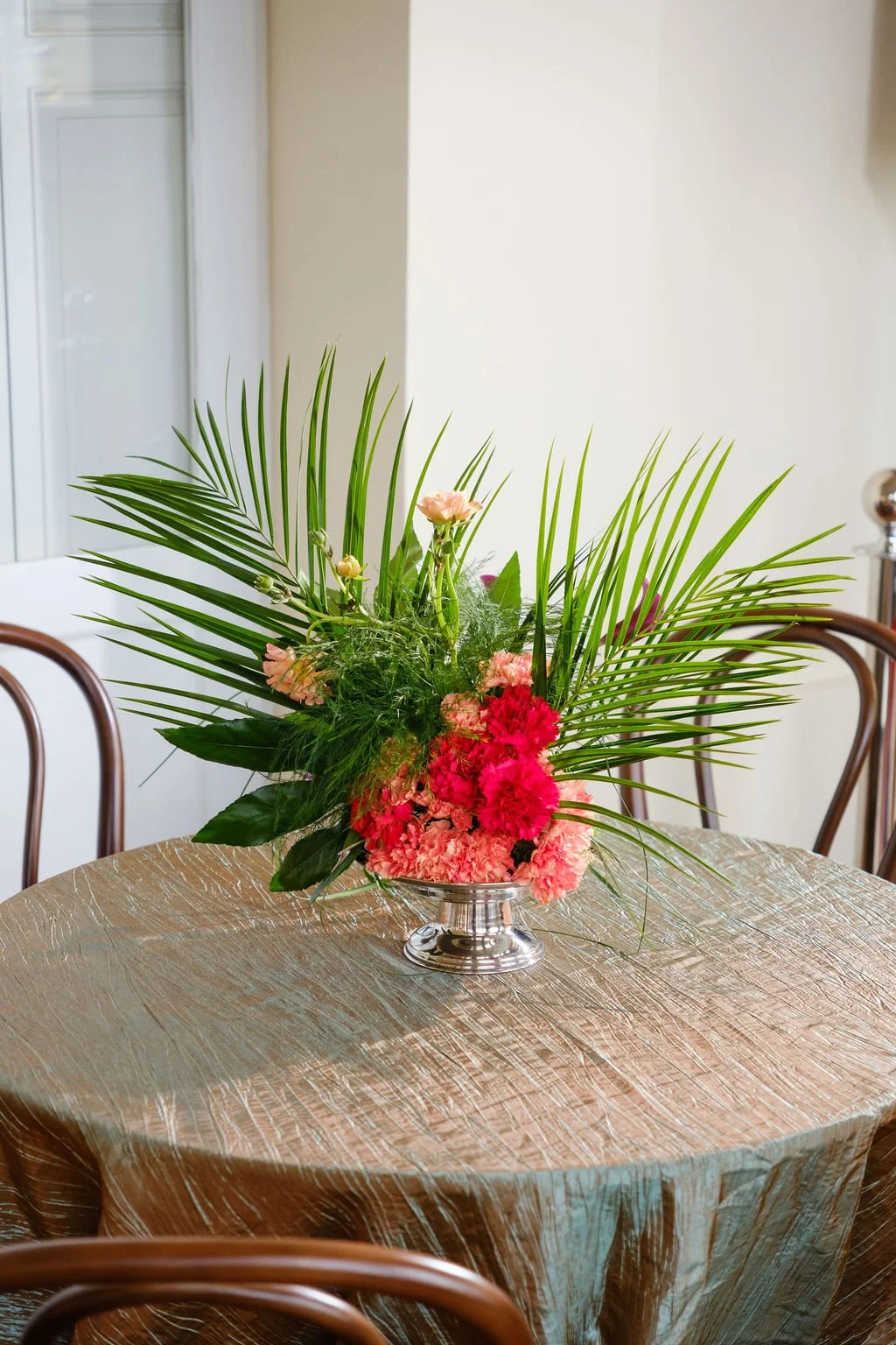 Greenery forward centerpiece with seasonal florals New Orleans plant rentals and New Orleans event florals corporate events and weddings