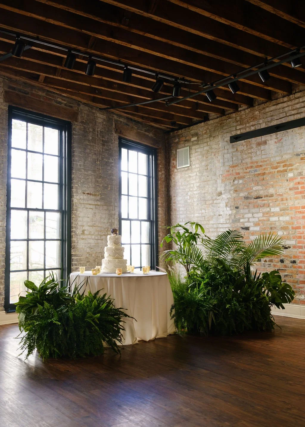 elegant-wedding-cake-table-plant-installation-lush-design.jpg