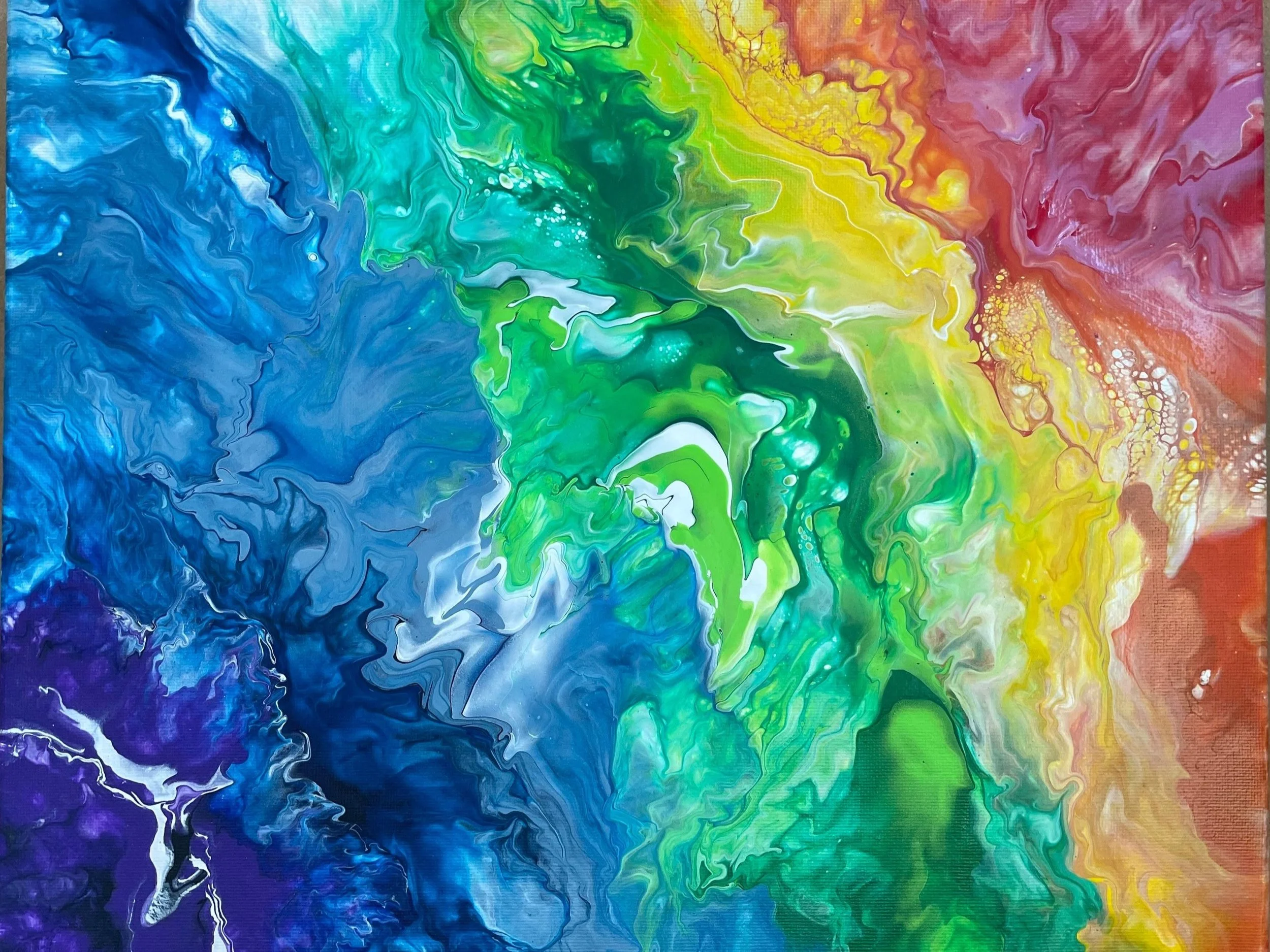 Abstract fluid art painting with swirling colors of blue, green, yellow, red, and purple.