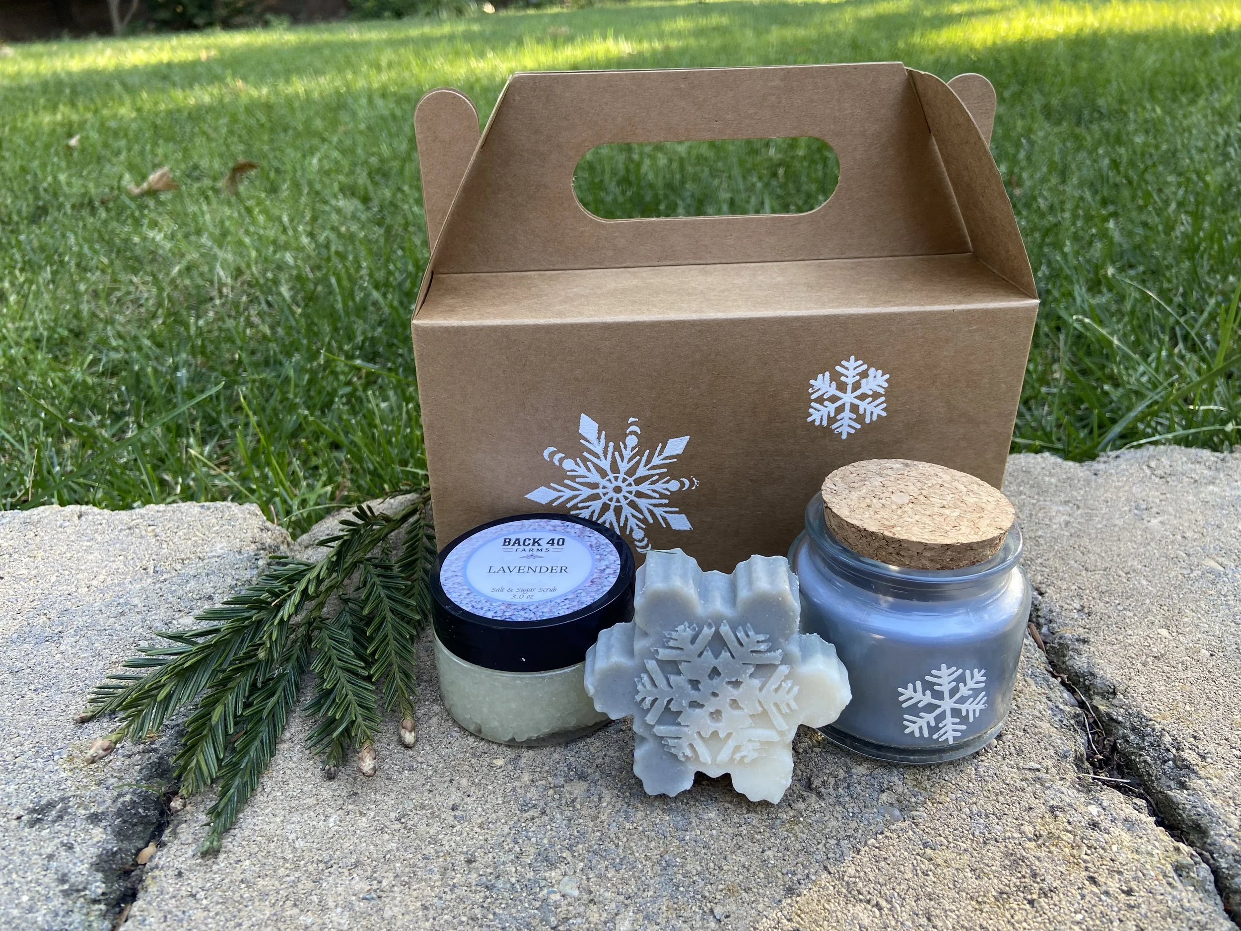 Christmas box with snowflake soap, candle and scrub