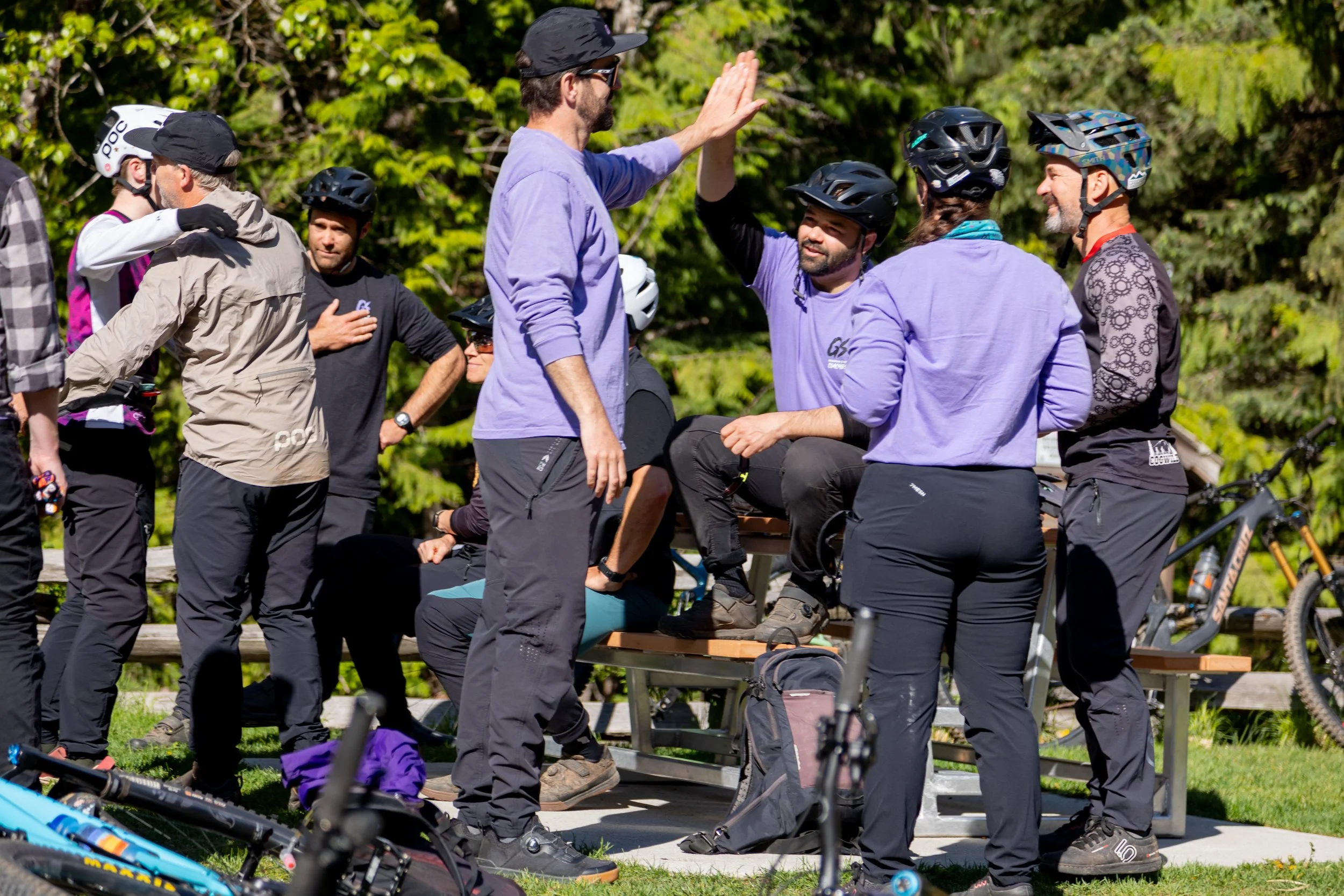 A group of mountain bike coaches connecting on a professional mountain bike instructor certification course