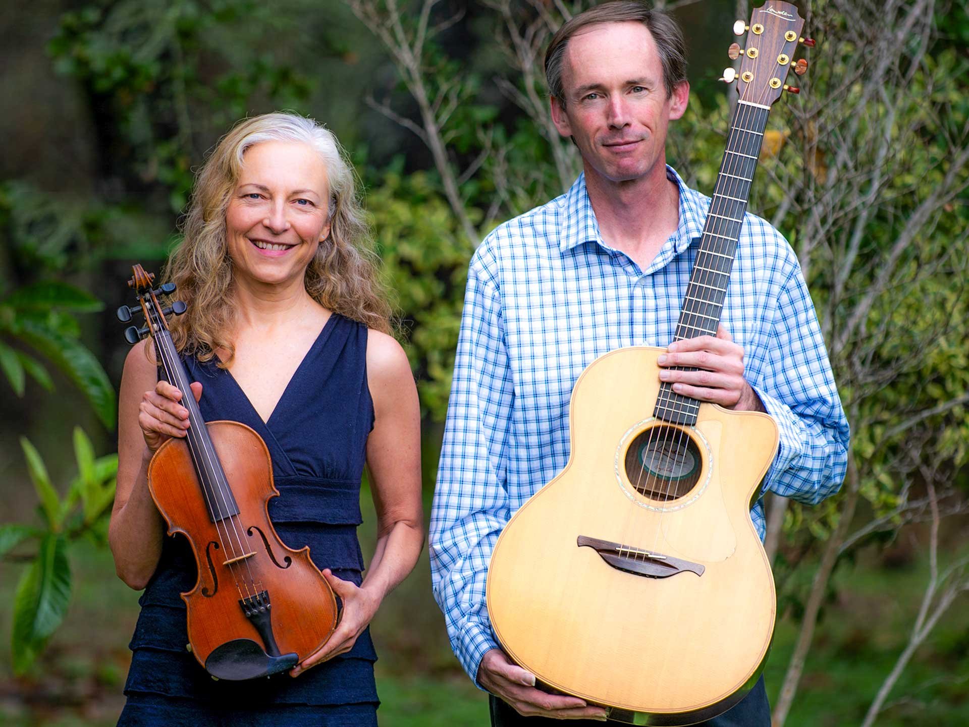 Suzuki Cady and Jimmy Murphy holding instruments