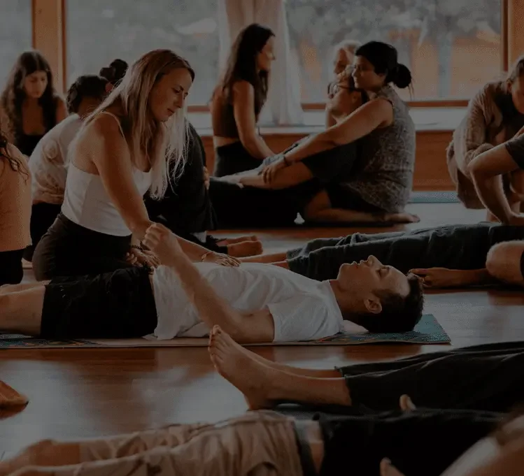 Lara Wehbe guiding a group session of emotional release with people working in pair