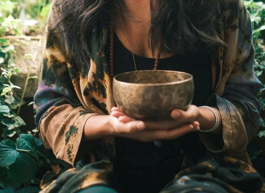 Lara Wehbe sound bath Glasgow holding a singing bowl