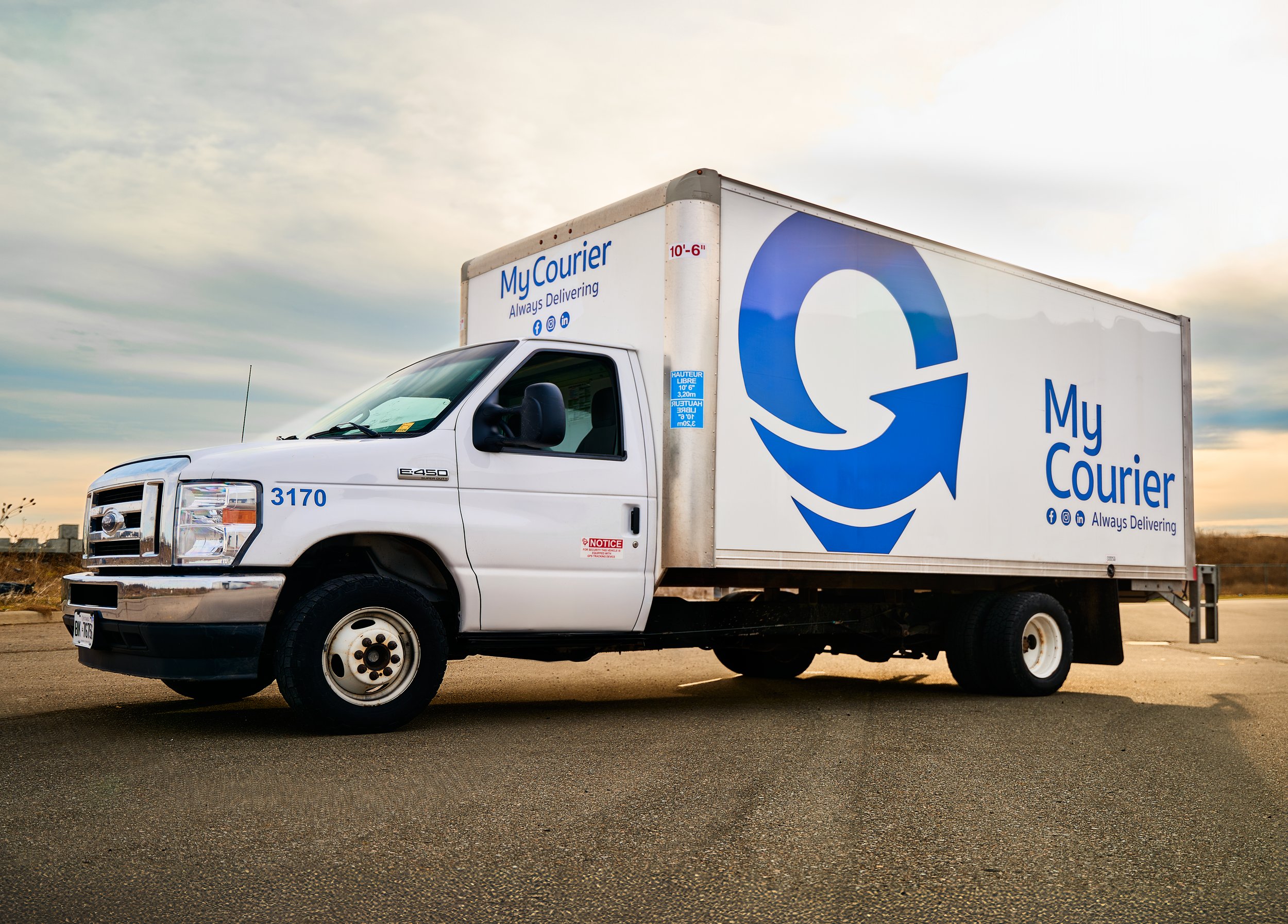 Photo of a MyCourier truck that is delivering a big and bulky item