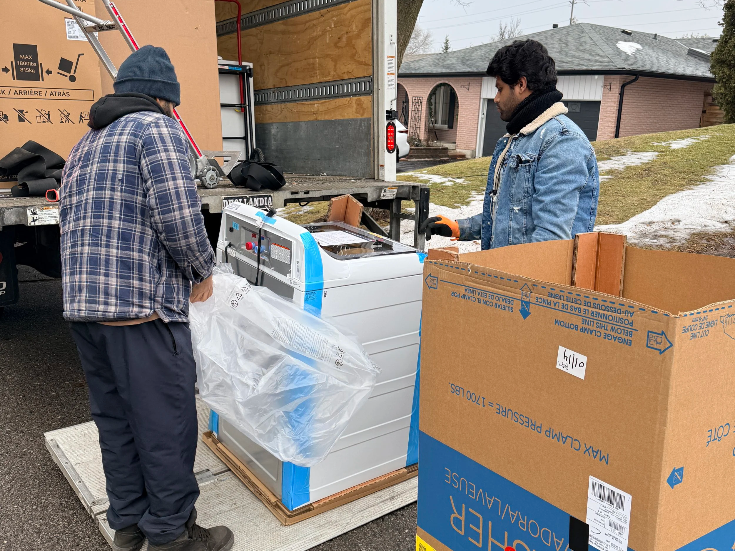 delivery associates delivering a washing machine