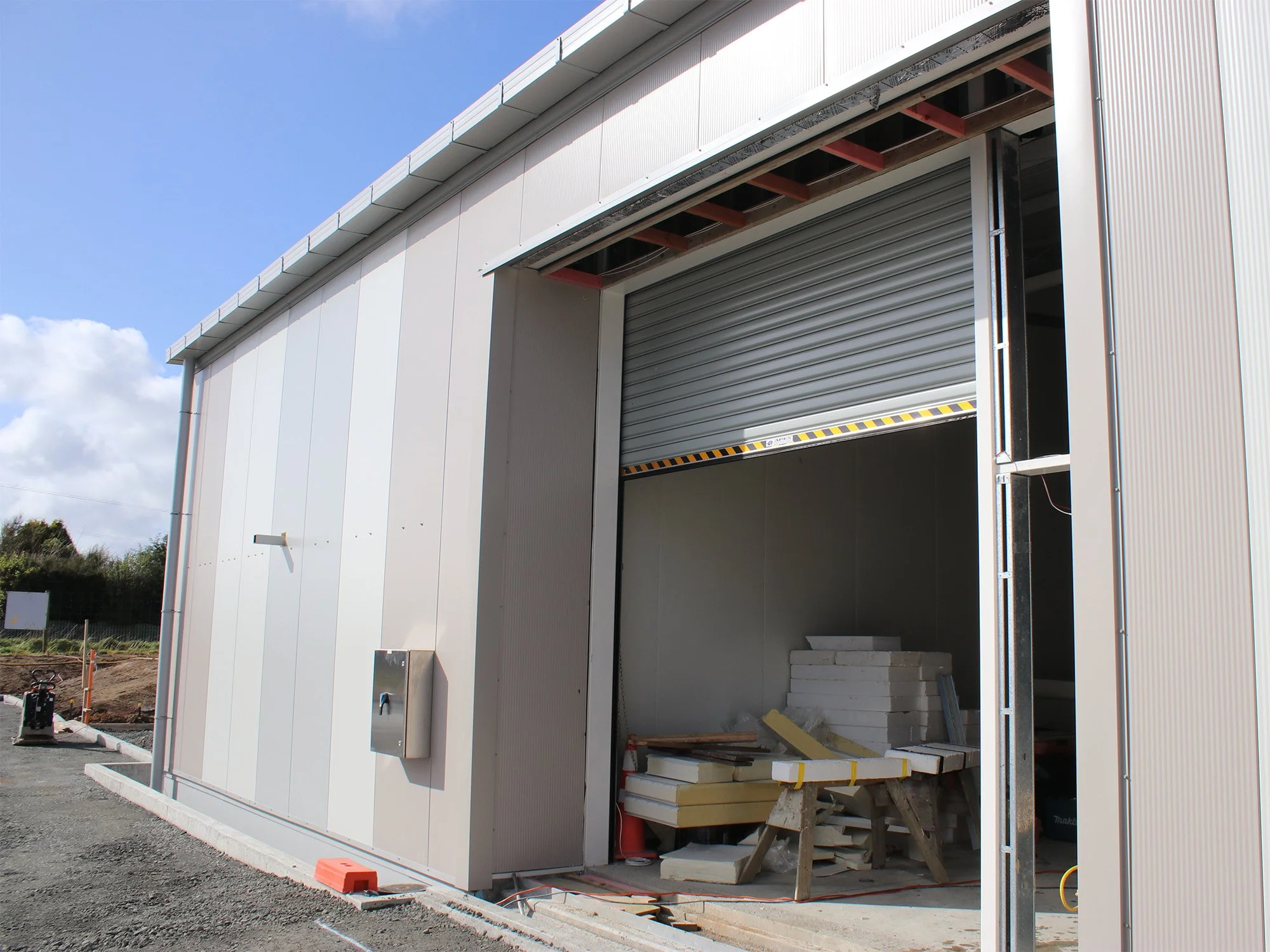 The rolling door that will provide access for the larger items of the collection has also been installed.