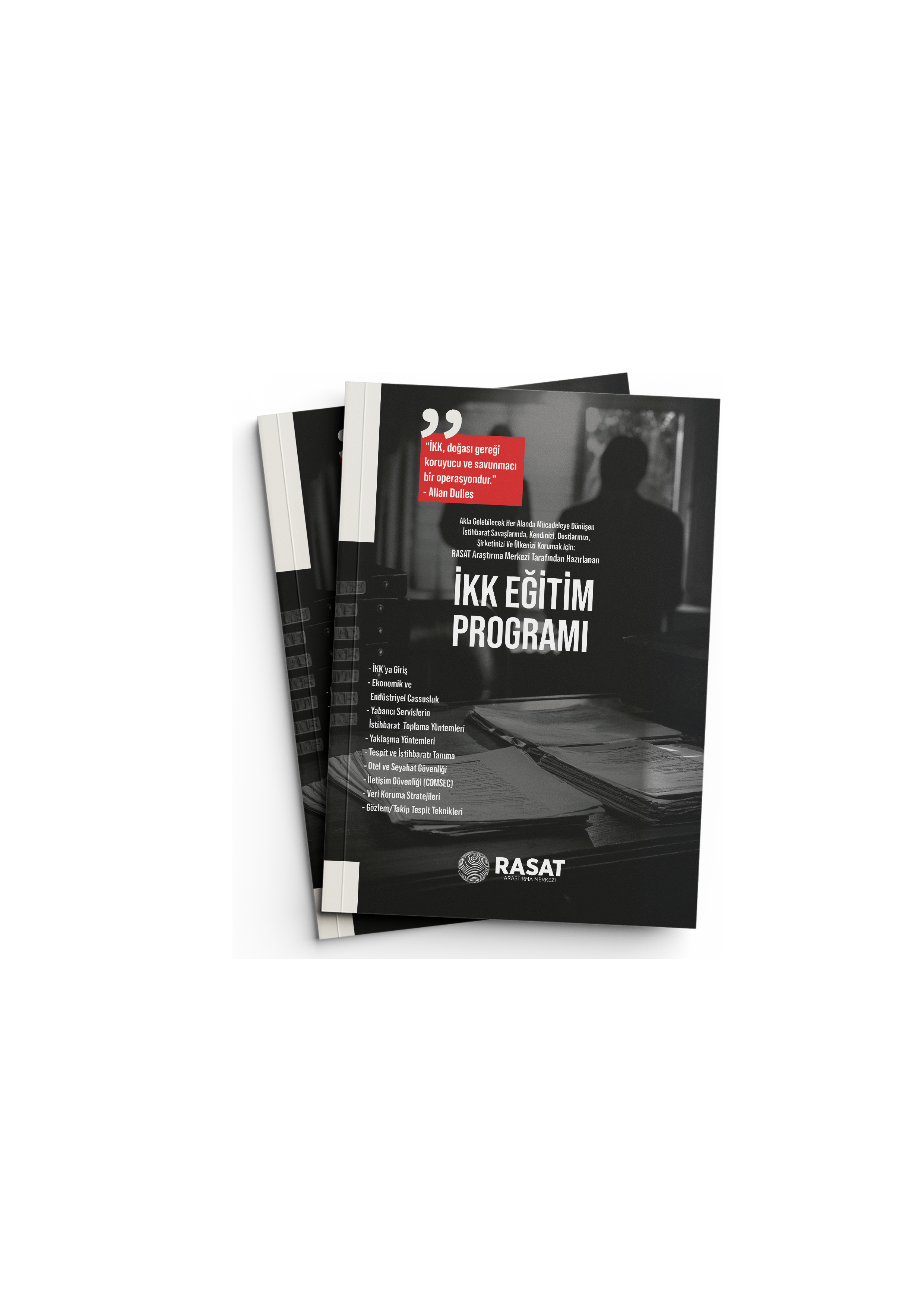 Birden fazla siyah kapaklı broşür veya kitapçık, üzerinde 'İKK Eğitim Programı' yazısı ve RASAT Araştırma Merkezi logosu bulunan, arka planı bulanık bir ofis veya çalışma ortamında duruyor.
