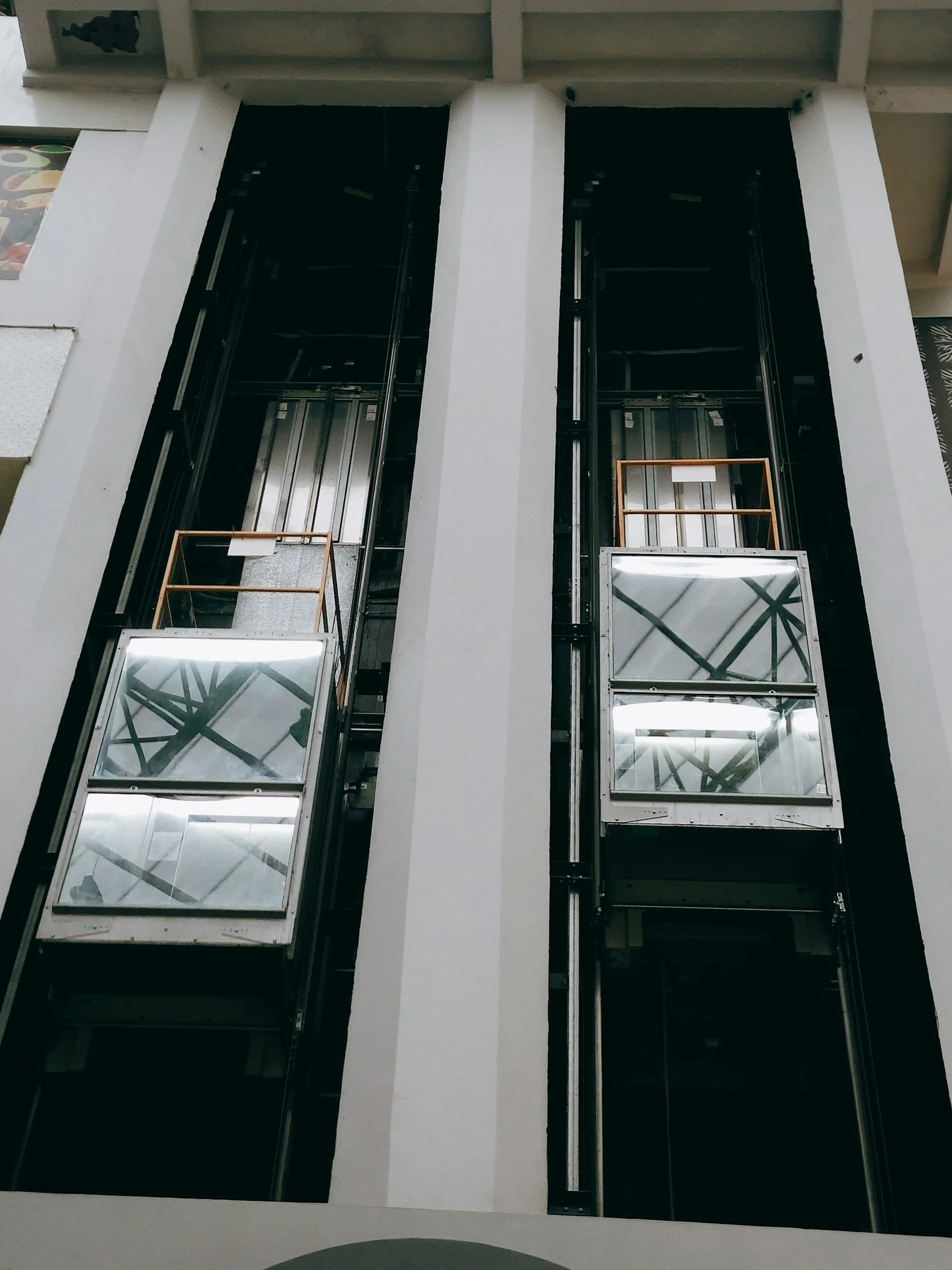 Outside of building with 2 glass elevators