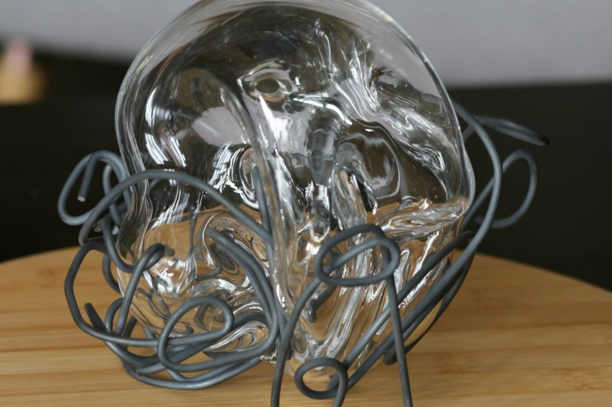Detail of Steel metal cage and clear glass orb