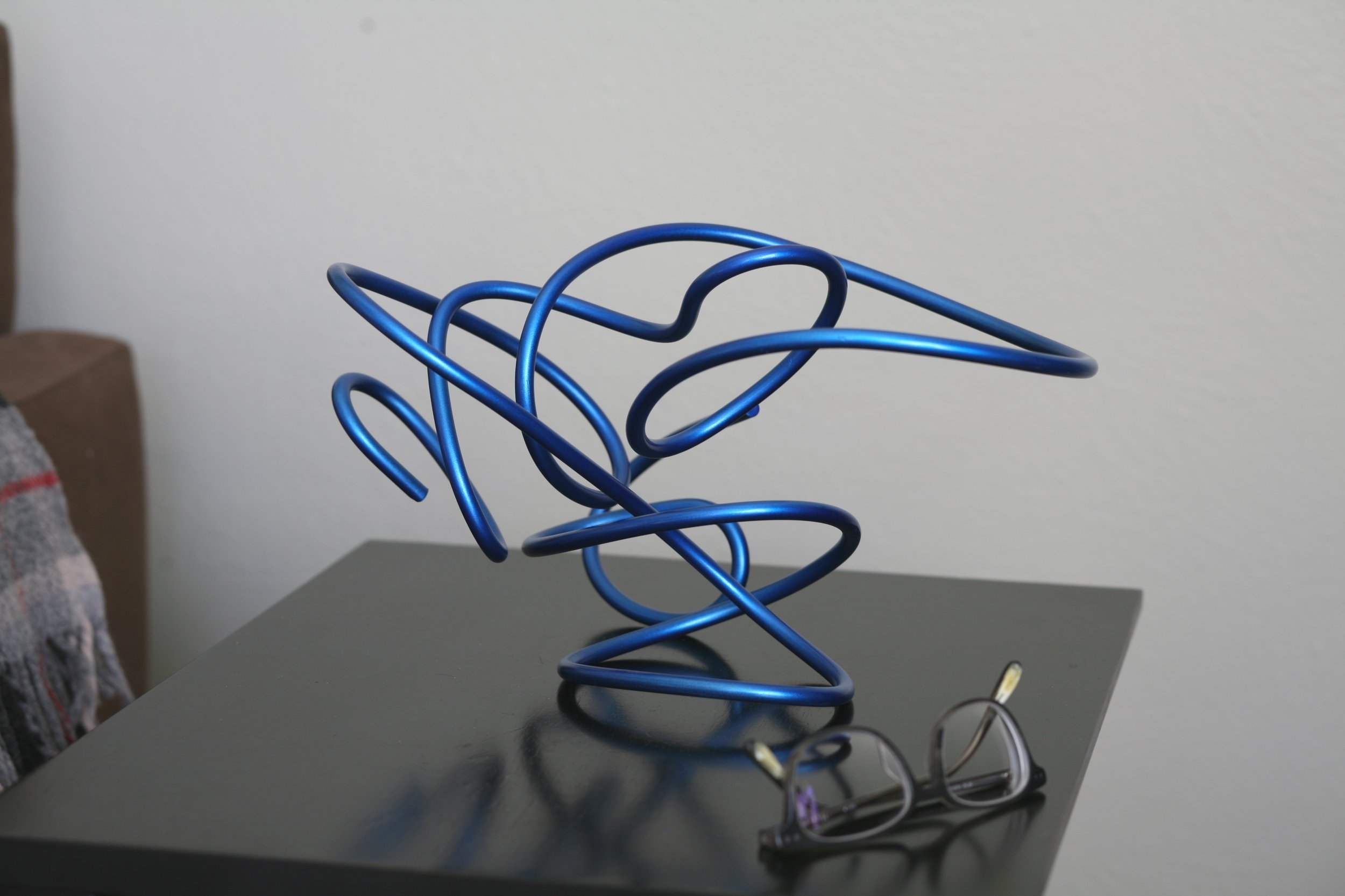 Twisted metal abstract sculpture, metallic blue