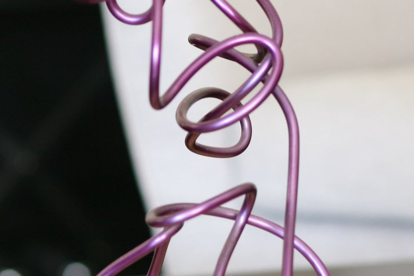 detail of purple steel twisted rod sculpture