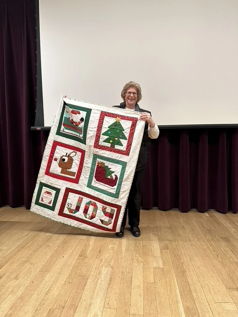  Theresa showed a christmas quilt [see back below]. 