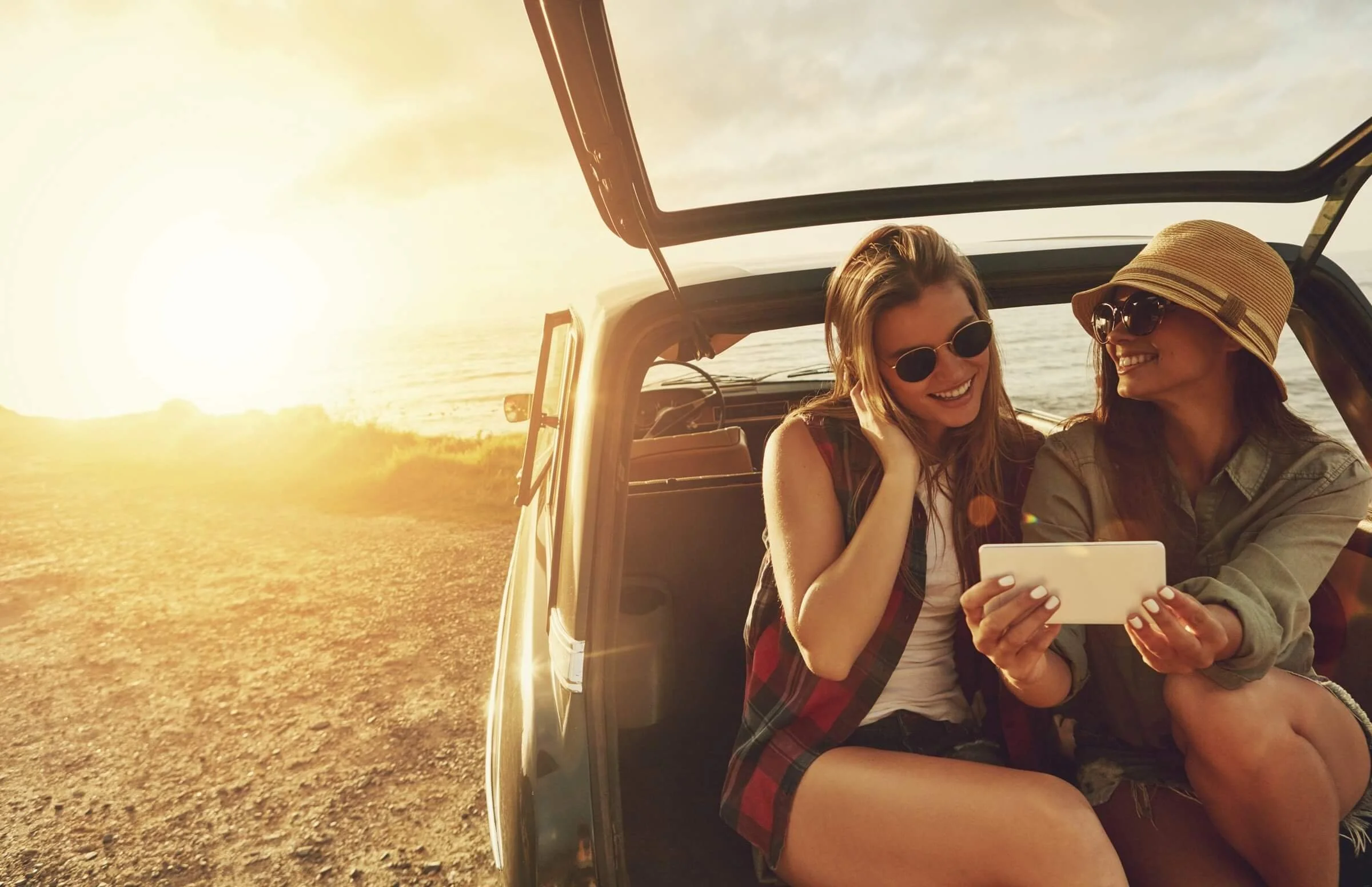 girls in car on phone