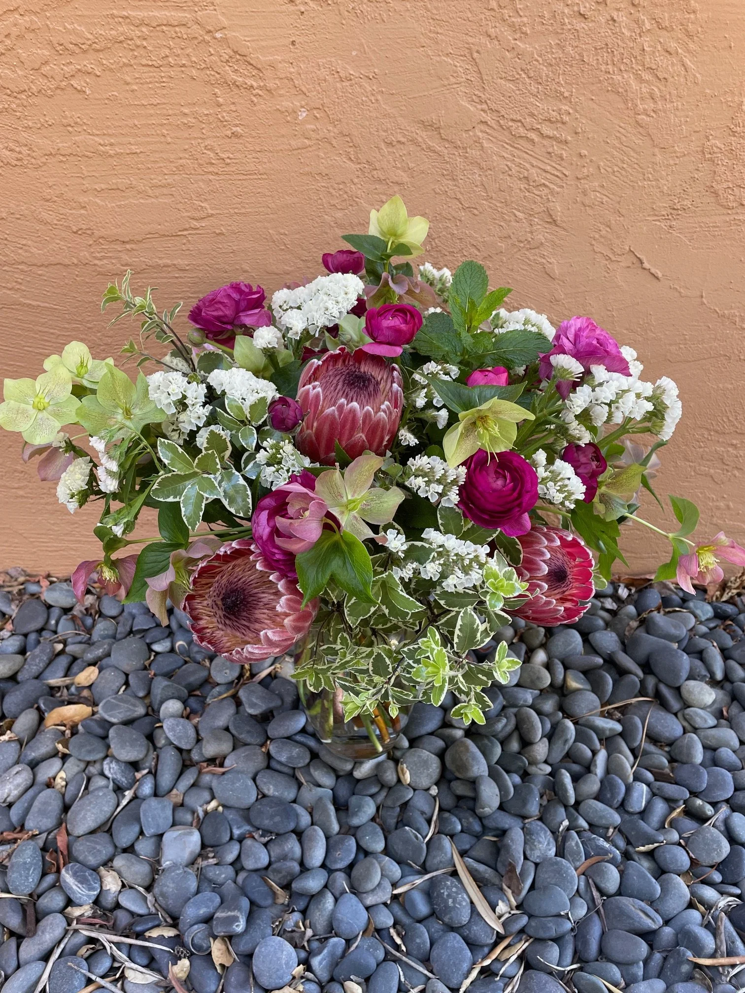 Wild Leaf Flowers signature arrangement with protea and hellebore.jpeg
