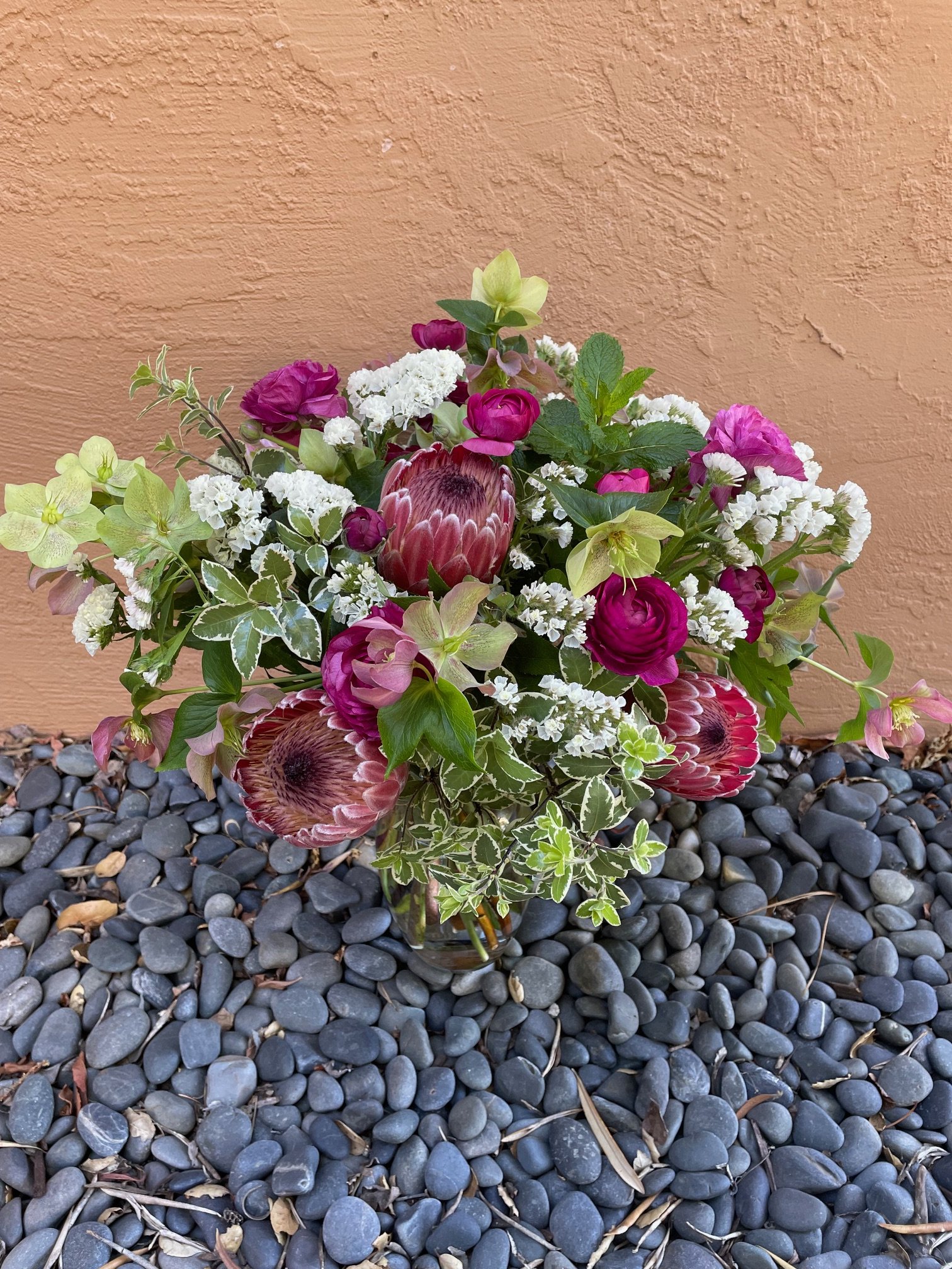 Wild Leaf Flowers deluxe arrangement with protea and hellebore.jpeg