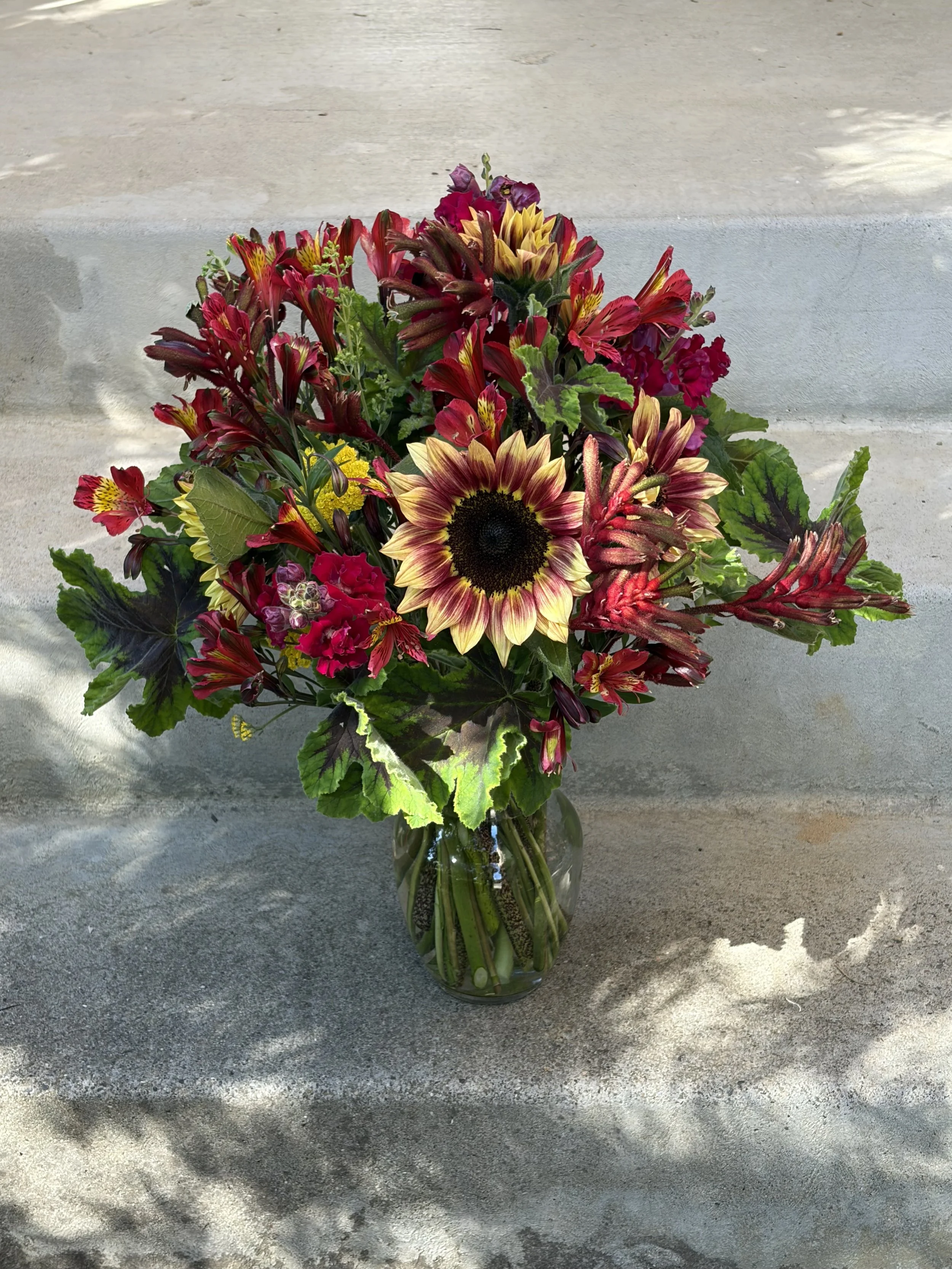 Wild Leaf Flowers red signature arrangement with sunflowers.jpeg