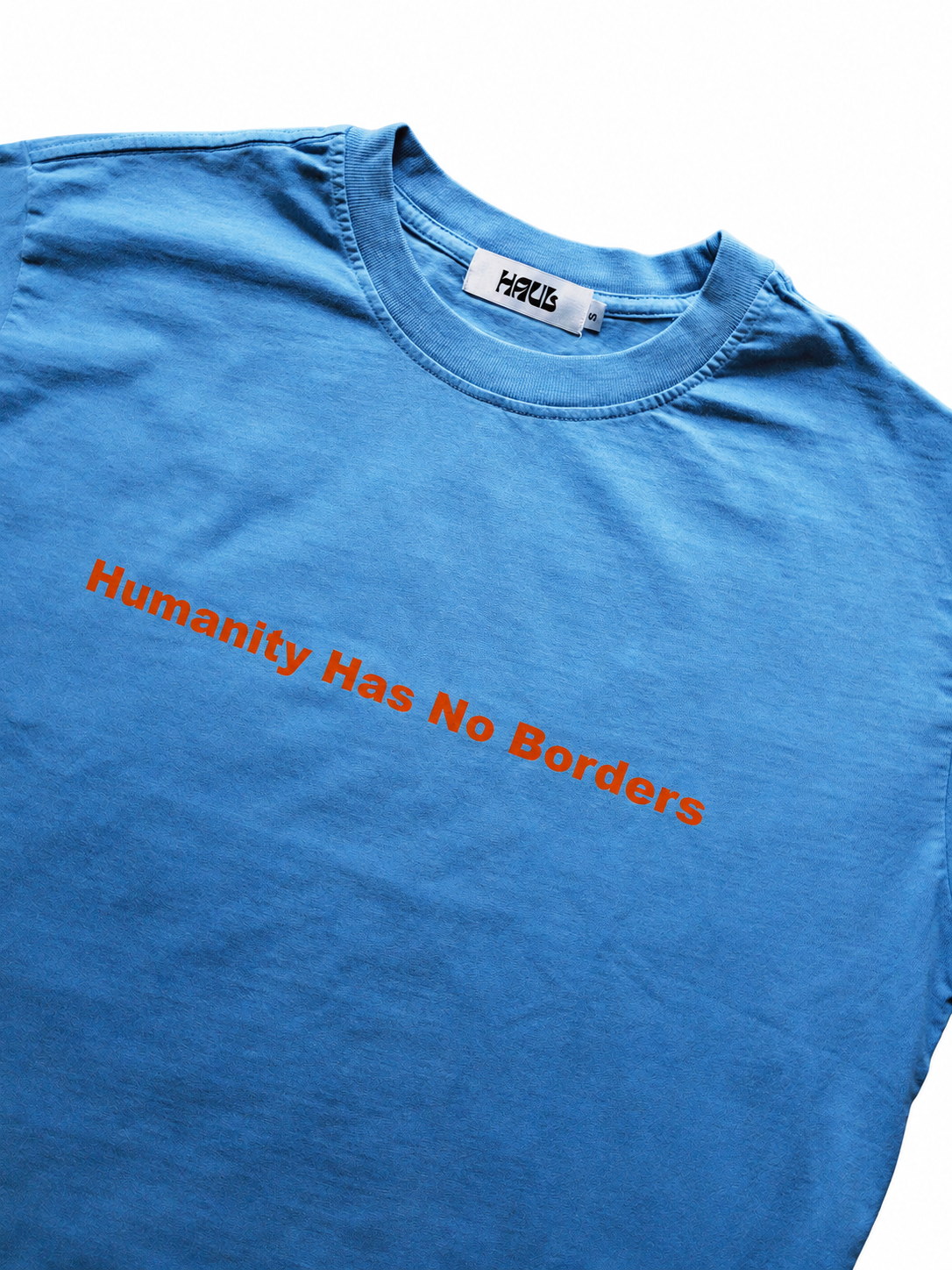 Blue shirt with orange lettering on white.png