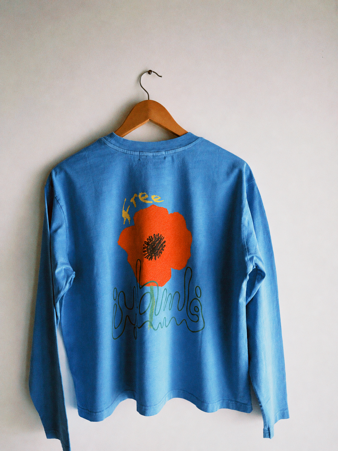Restored flower print on blue shirt.png