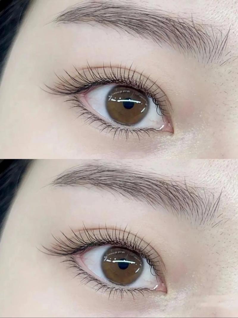 Close-up of two human eyes with brown irises, set against smooth skin and neatly groomed eyebrows.