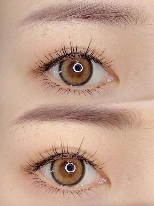 Close-up of two brown eyes with long eyelashes and light makeup