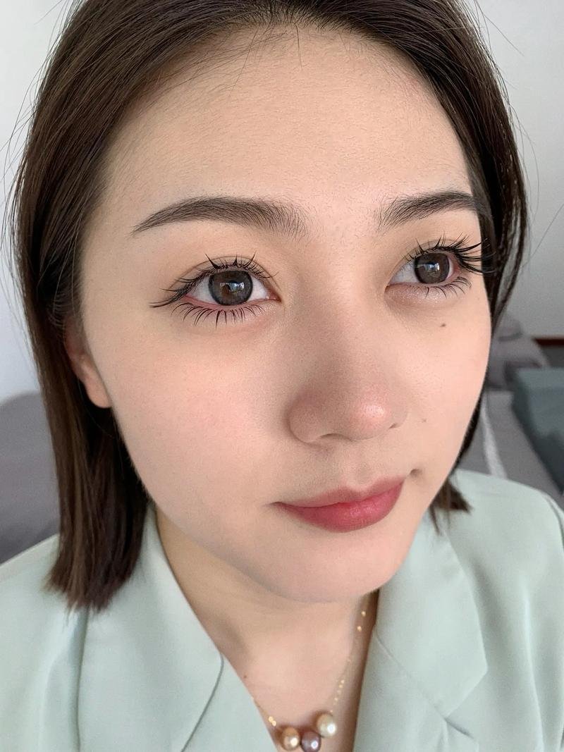 Close-up of a person with bob hairstyle and natural makeup.