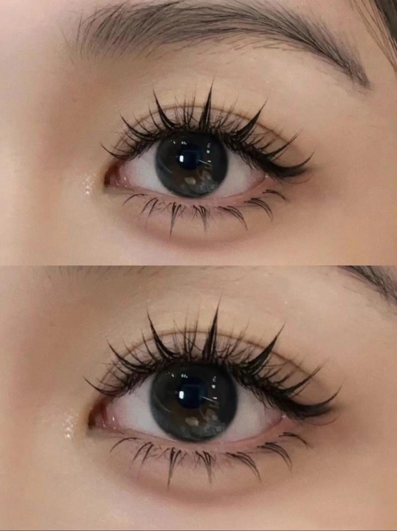 Close-up of a person's eye with long eyelashes and brown iris.