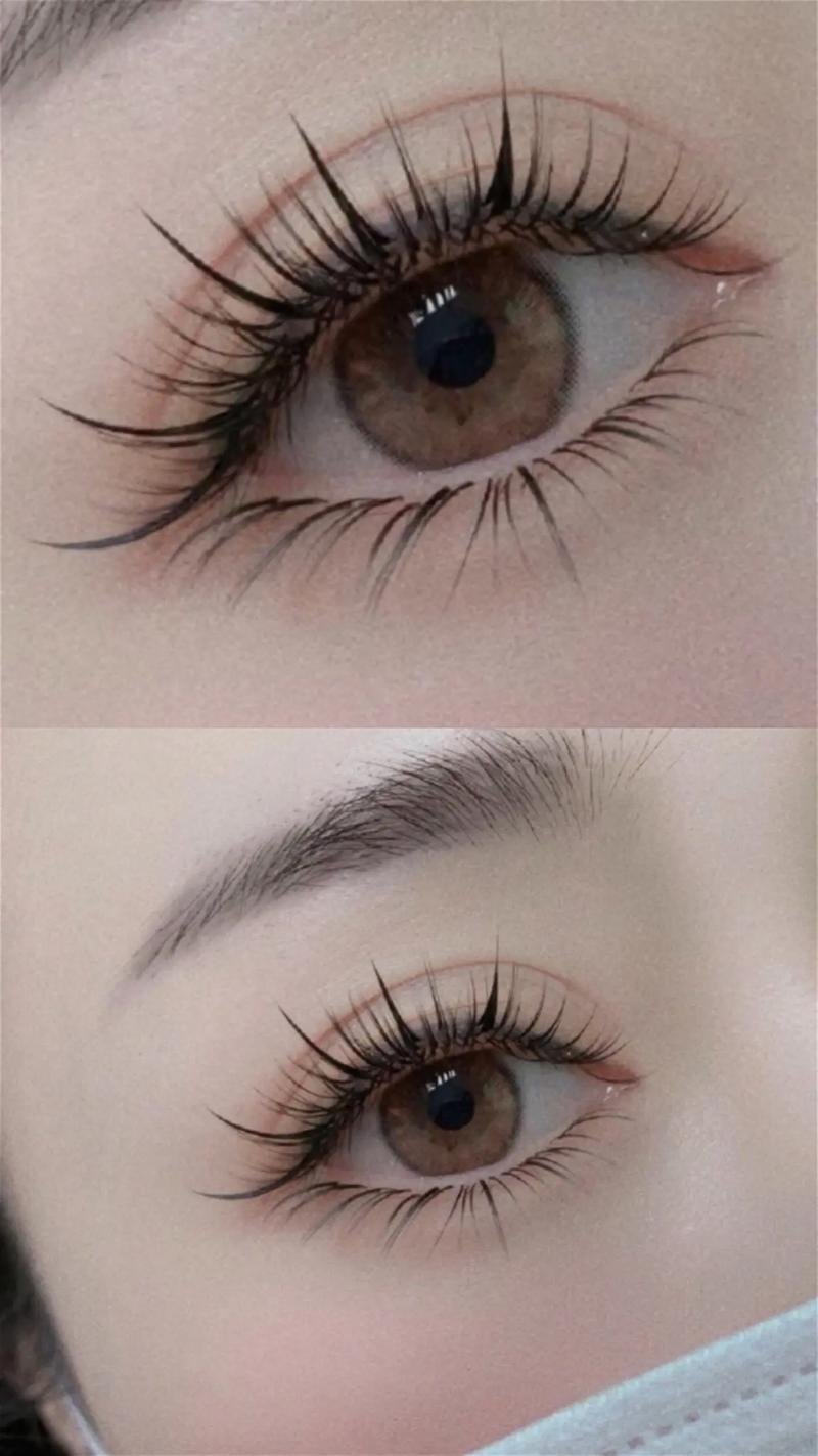 Close-up of two brown eyes with long eyelashes and defined eyebrows, partial face mask visible.
