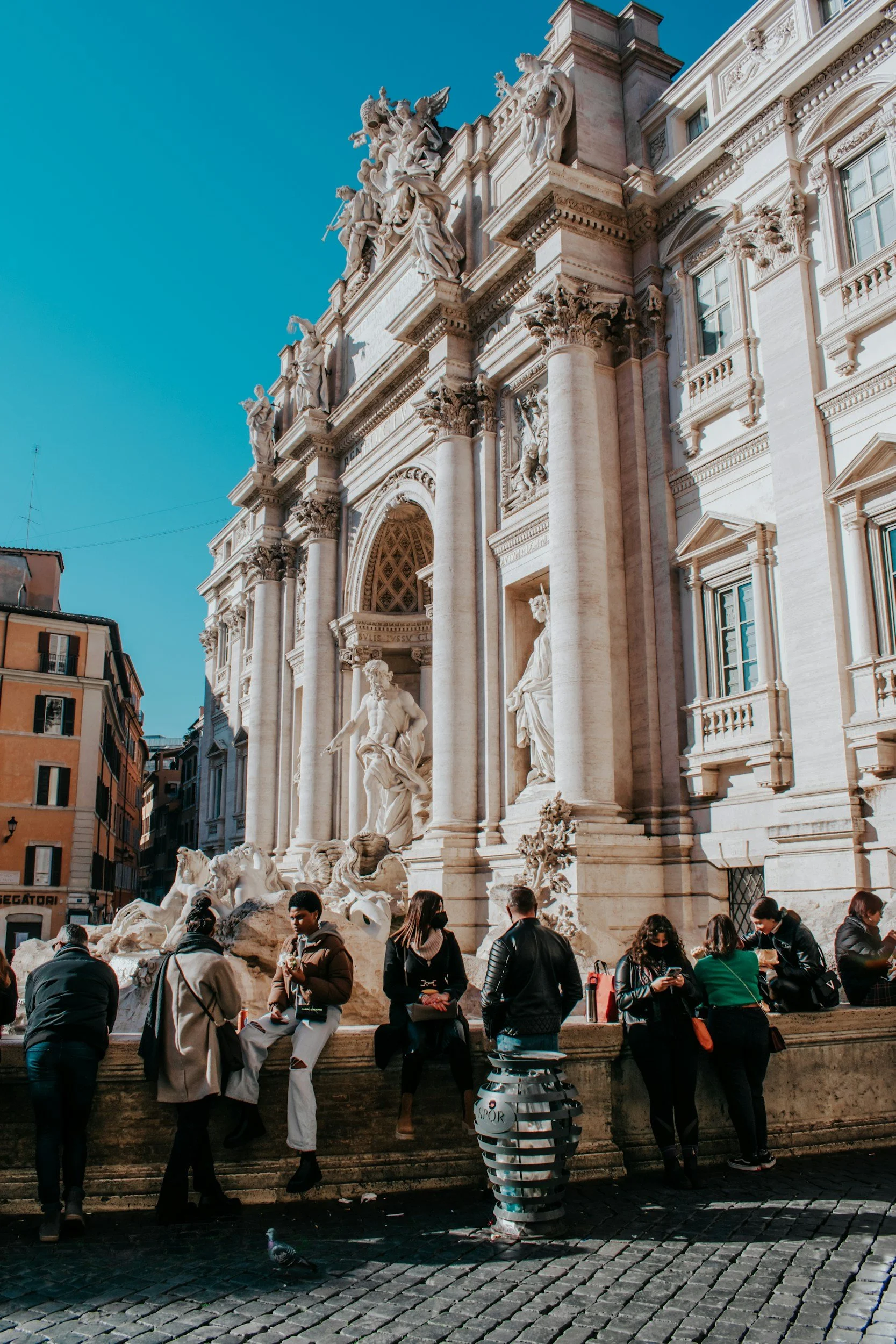 Families gathered at the Trevi Fountain in Rome, Italy