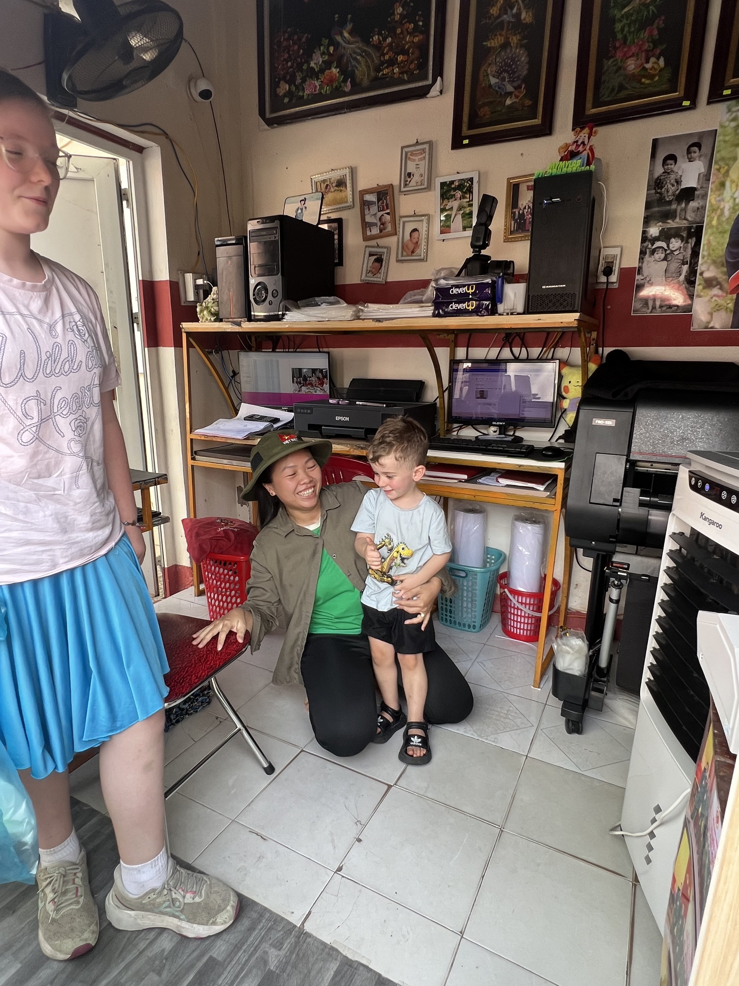 Getting passport photos printed at a local photo shop in Huế before the Vietnam to Laos visa run