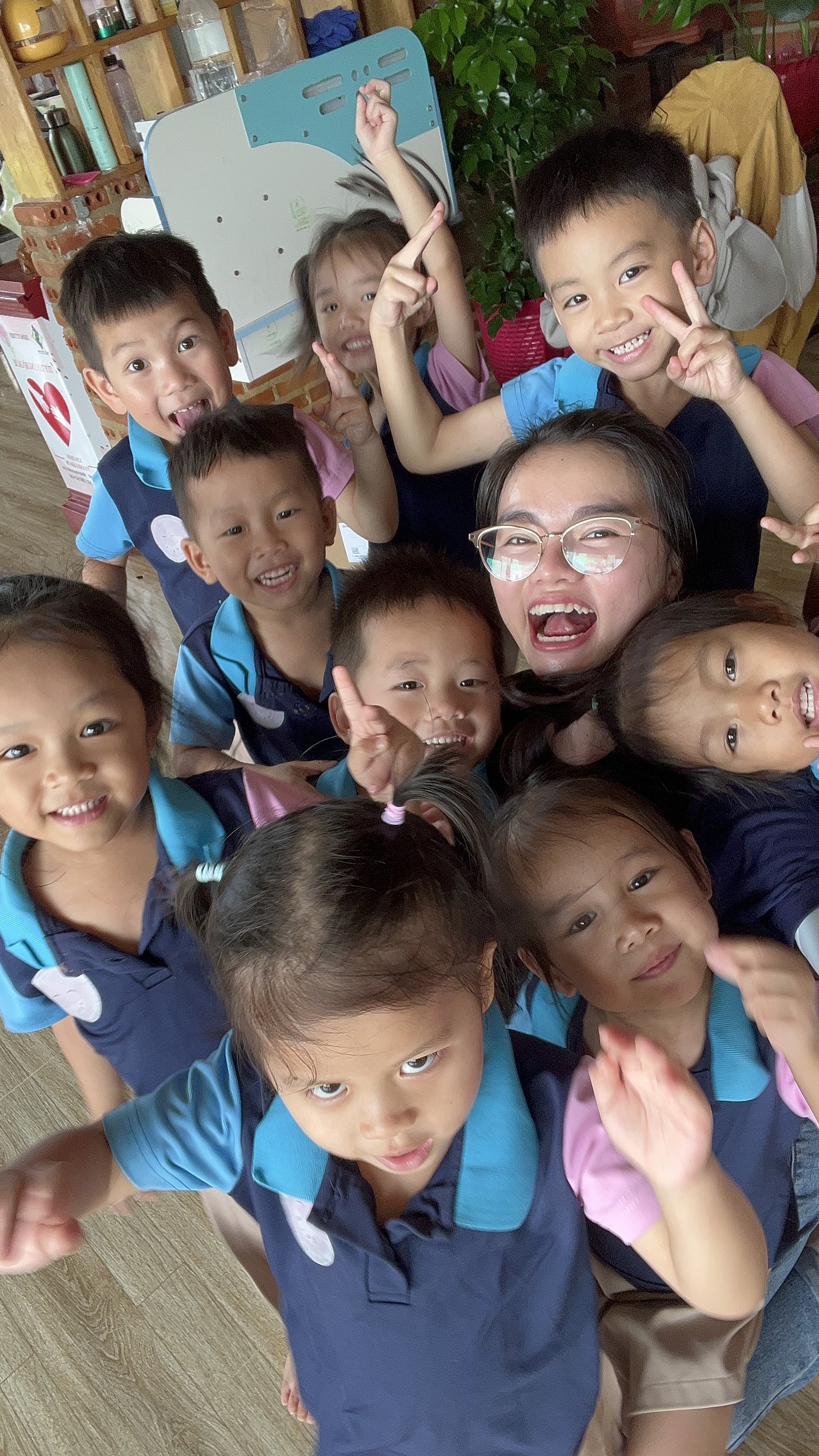 Children at Tue Minh orphanage smiling and posing together after their facility received solar power